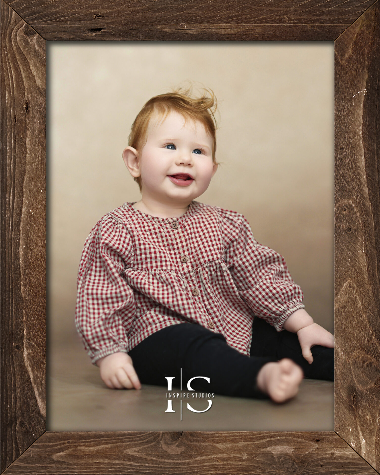 A baby playing with wooden toys in a bright London photography studio.
