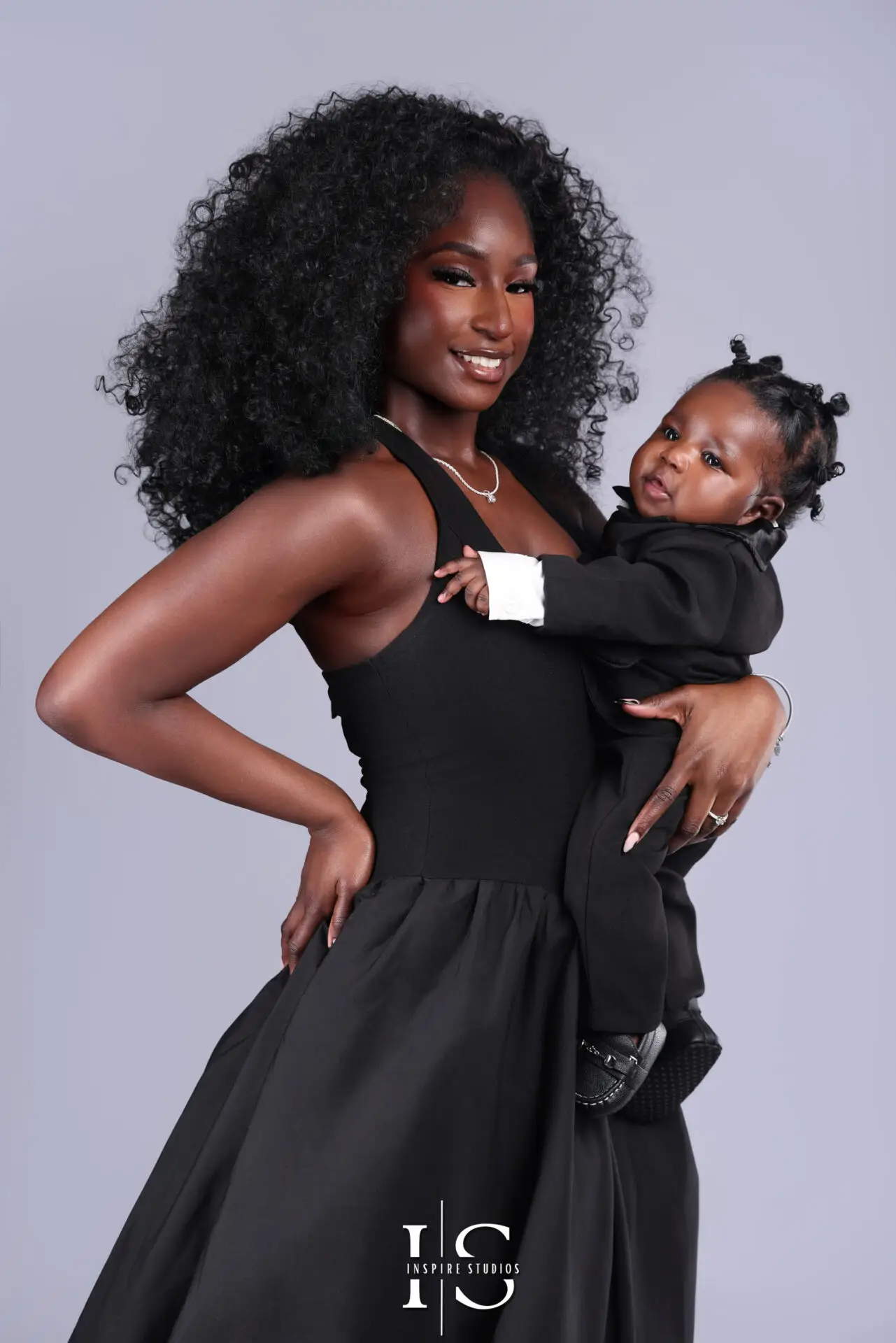 Family and baby studio portrait with soft lighting and cozy backdrop