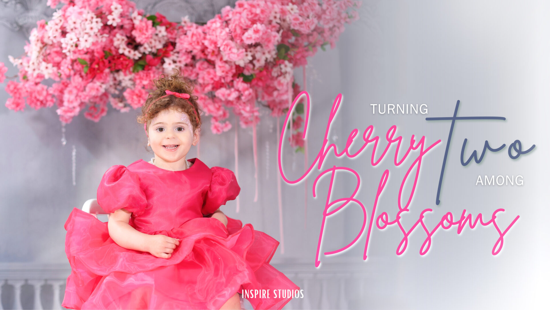 Toddler girl posing during her second birthday studio photoshoot.