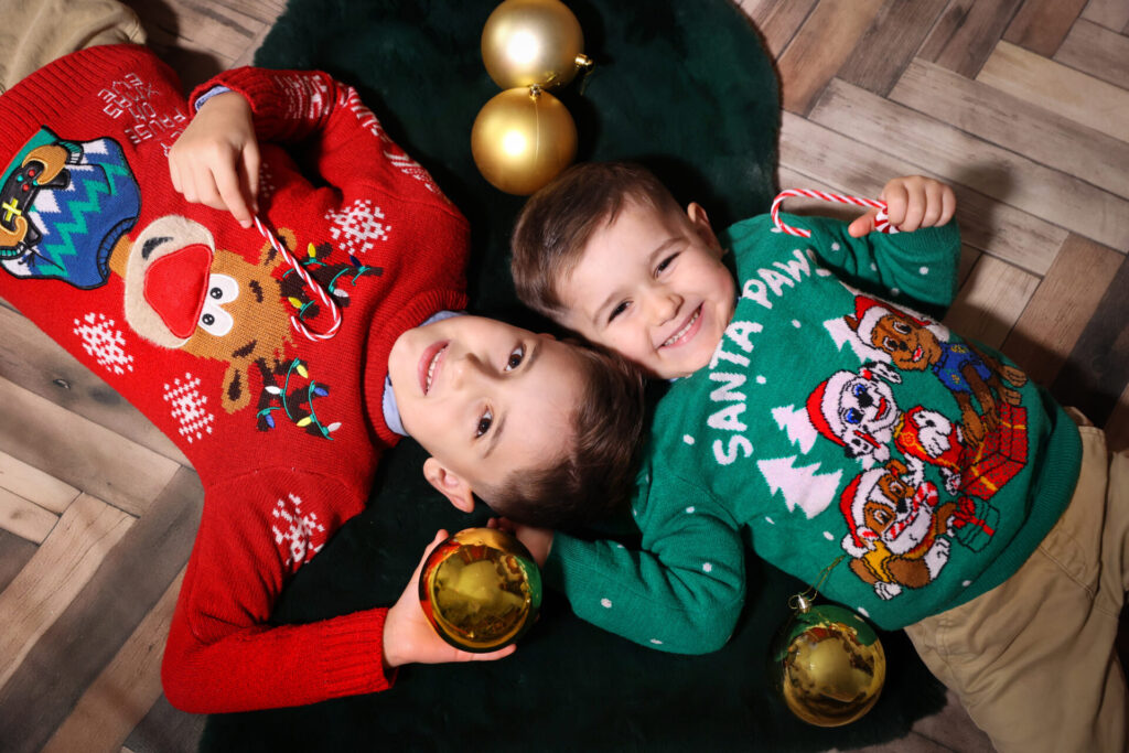 Elegant Christmas Eve photoshoot for children with a holiday decor.