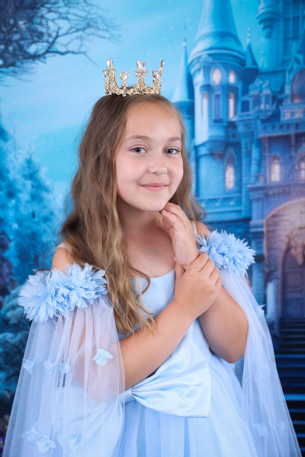 Little girl in a beautiful dress posing for a Cinderella Disney Children Photoshoot by Inspire Studios