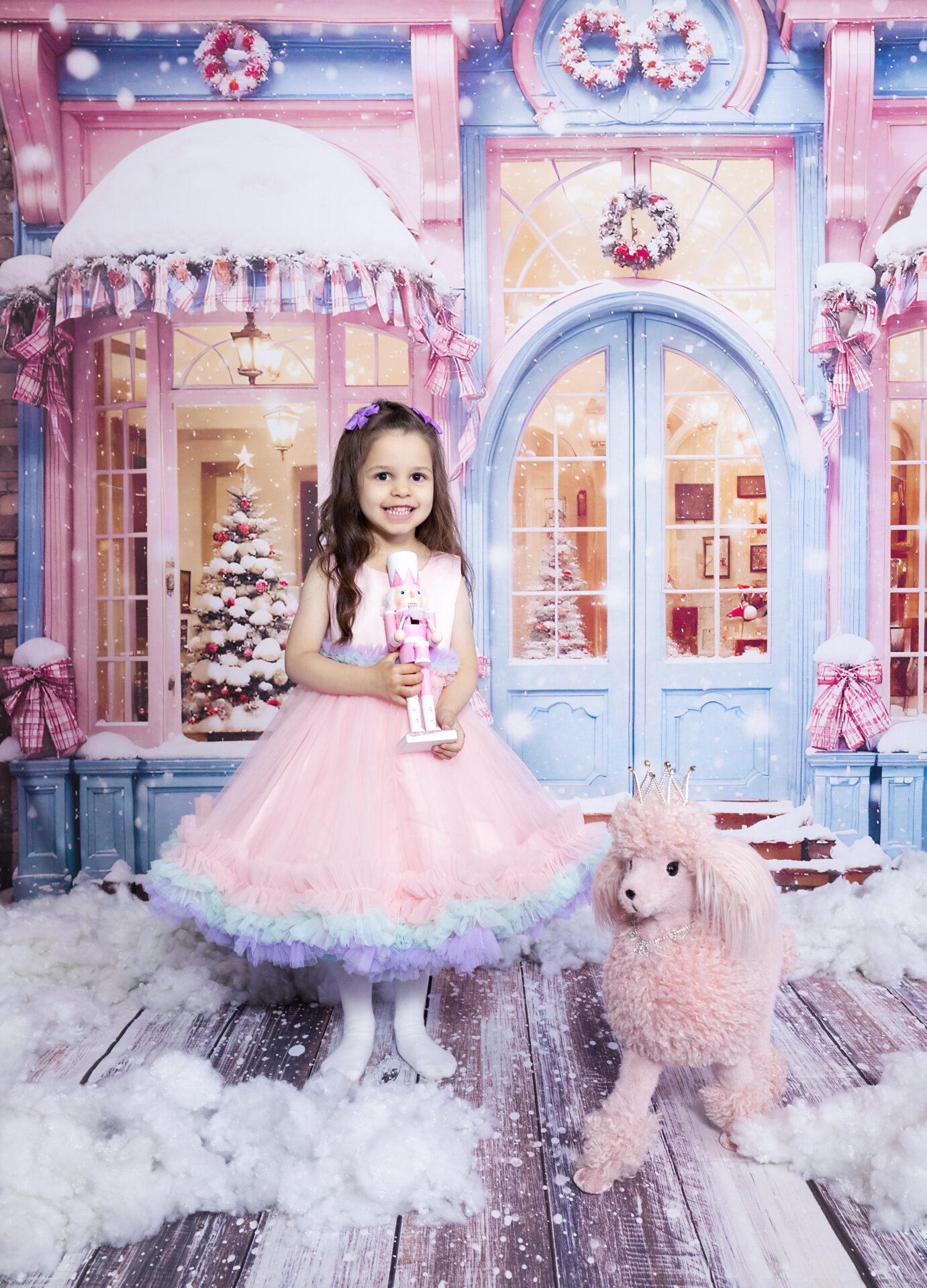 Barbie's Christmas photoshoot with Barbie-themed holiday decor and pink tree decorations.