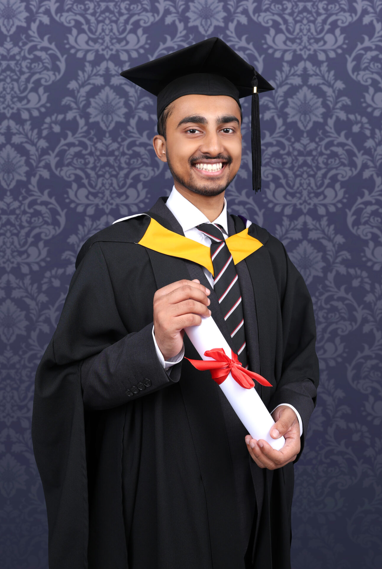 Graduation Photography with gown, mortarboard and hat.