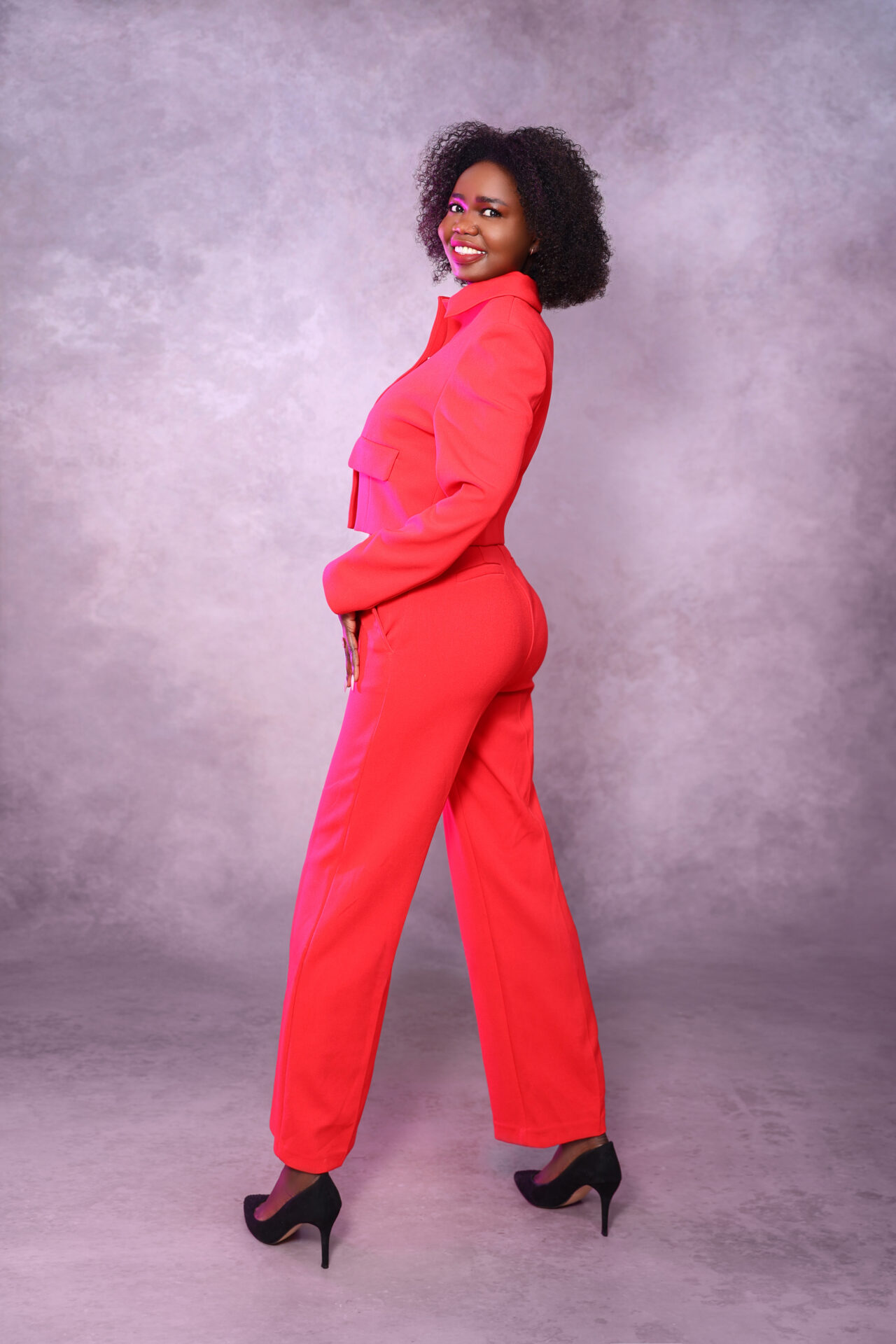 Woman elegant dressed posing during a birthday studio photoshoot in London.