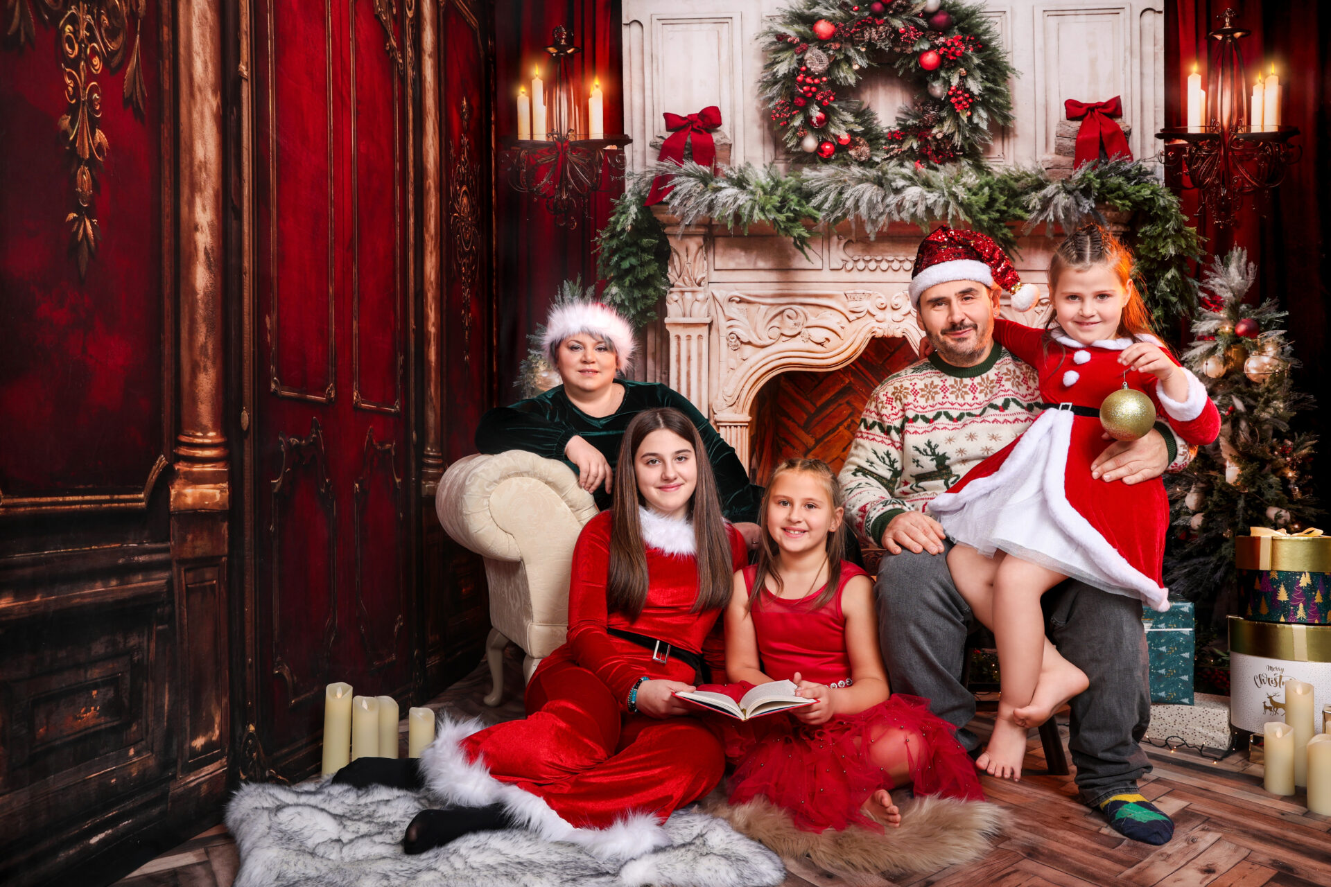 Family dressed for christmas mini session captured by female photographer in studio in London.