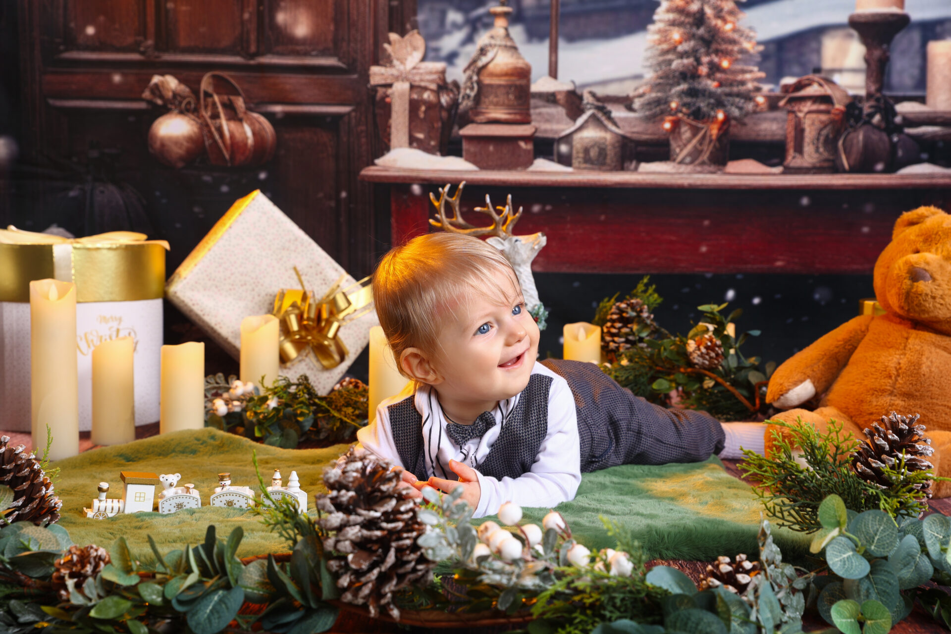 A child playing on a christmas festive decor in a photo studio during a mini session.