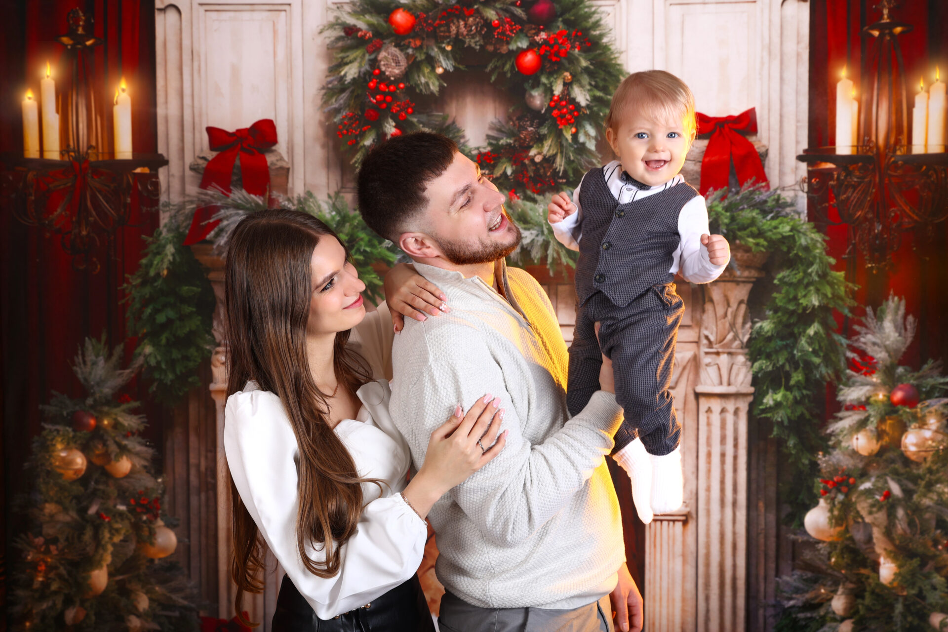 Happy family during a children festive christmas photoshoot during the christmas season.