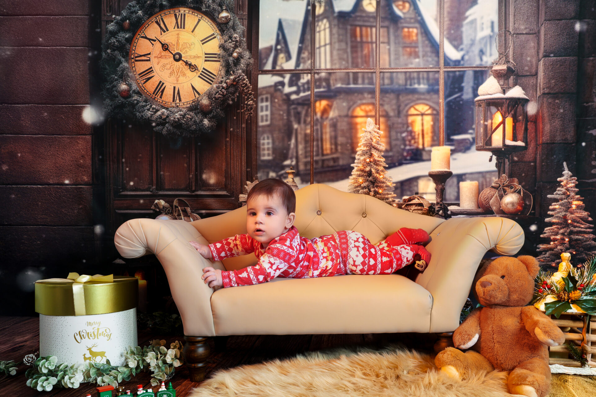 Child sitting on a coach photo during a children session in red velvet outfit in studio.