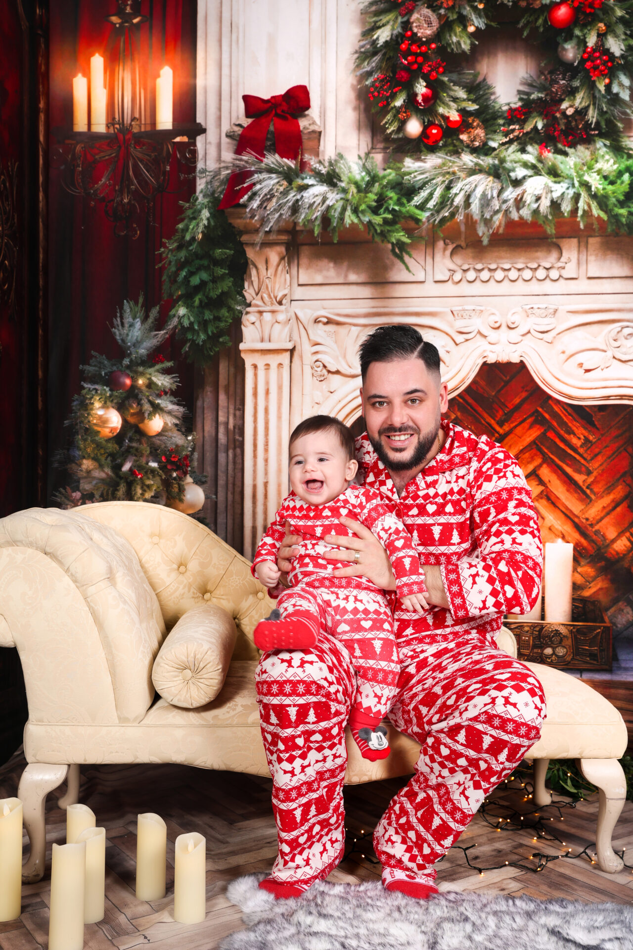 Father and son photo during a family session in matching outfit in studio.