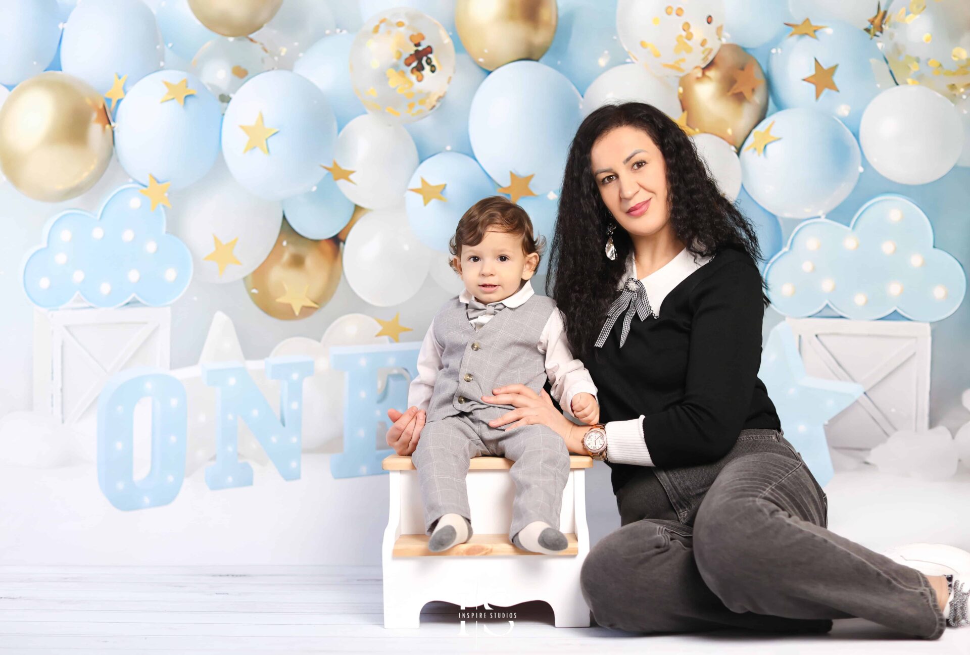 First Birthday Photoshoot session with happy family in photo studio based in London.