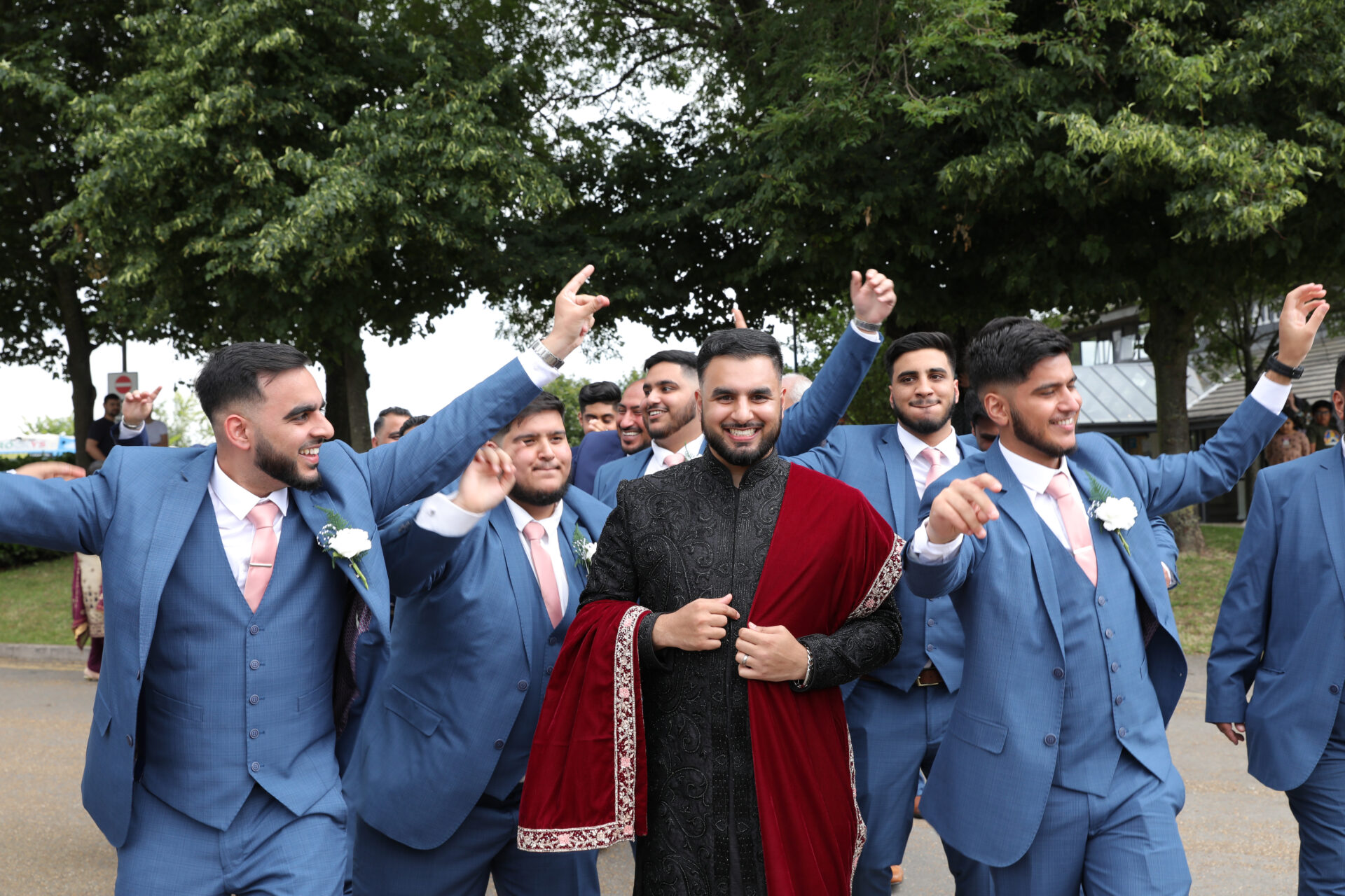 Groom and his groommaids happy captured by baraat wedding photographer.