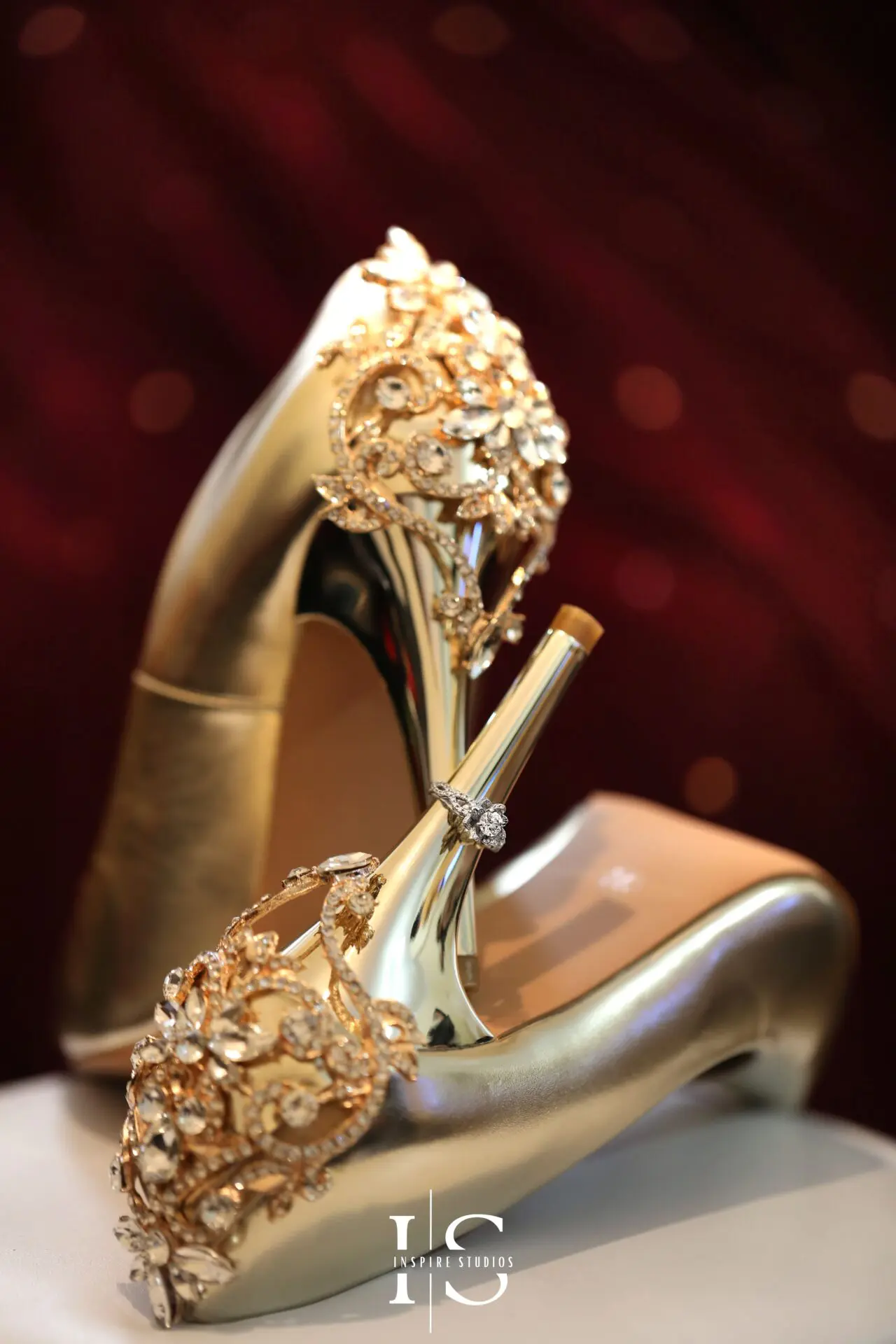 Bride adjusting her shoes before Baraat wedding in London.