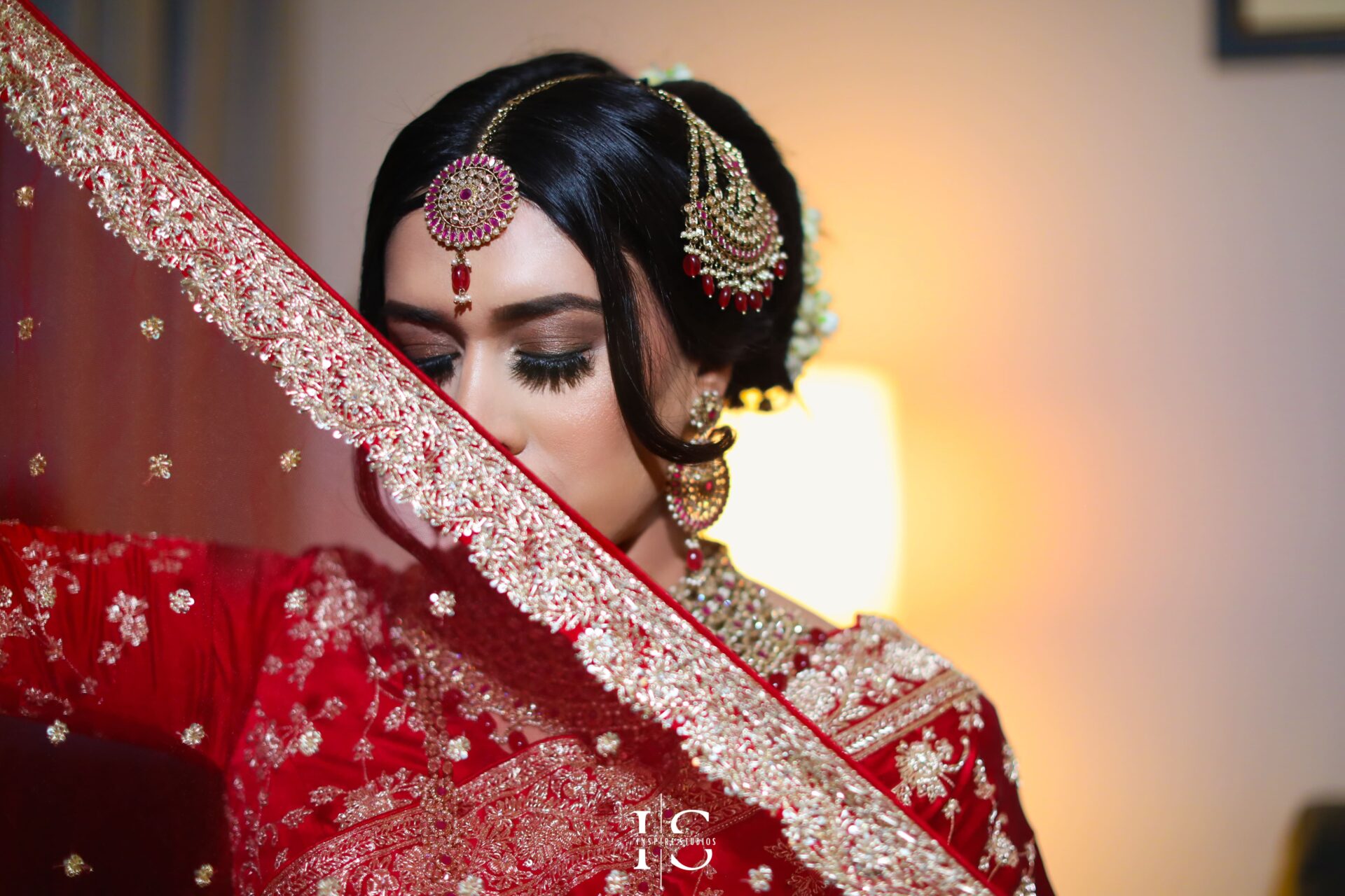 Bride getting ready during baraat wedding photography in London.