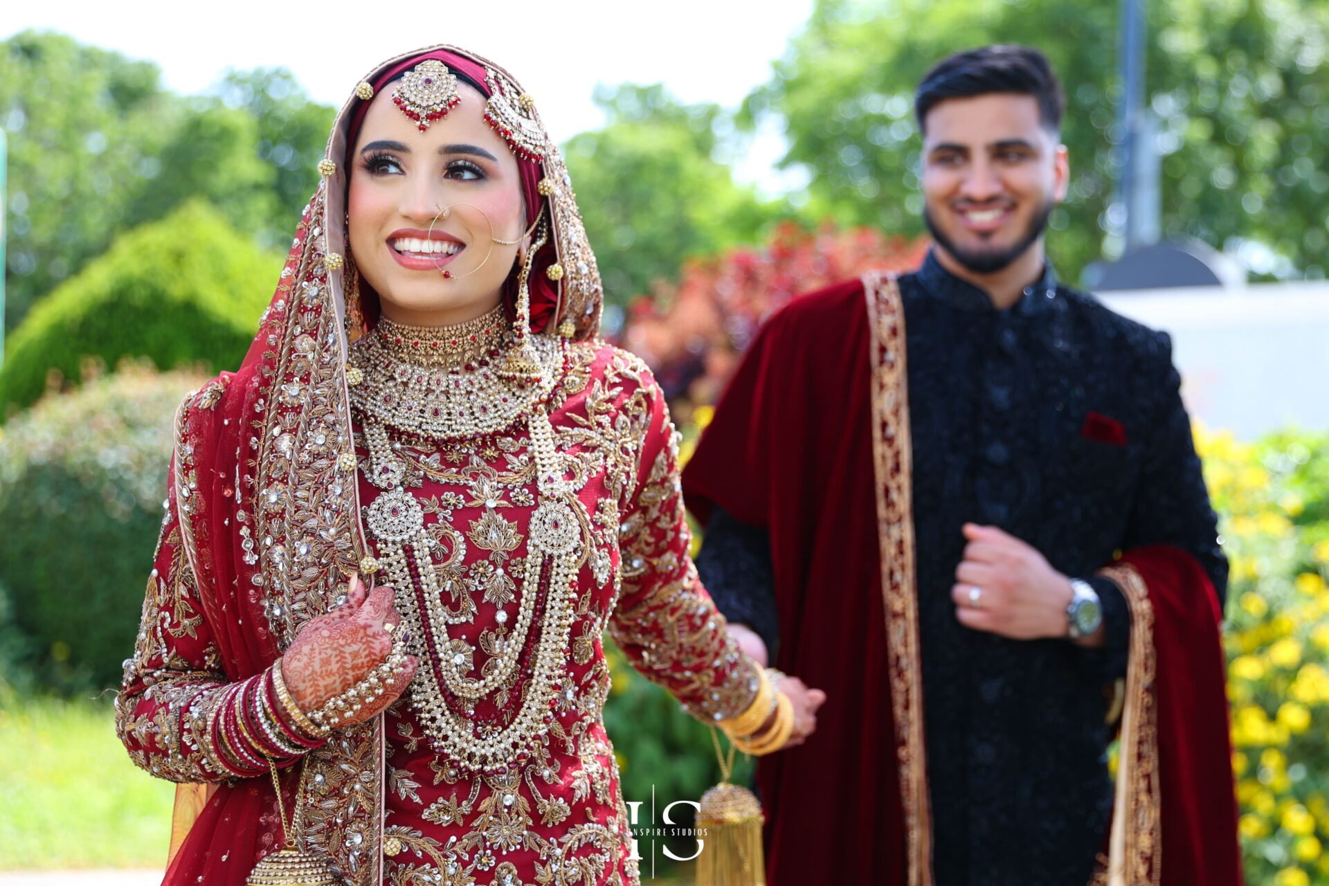 Bride and groom leaning close in a timeless portrait from a traditional baraat wedding in London.