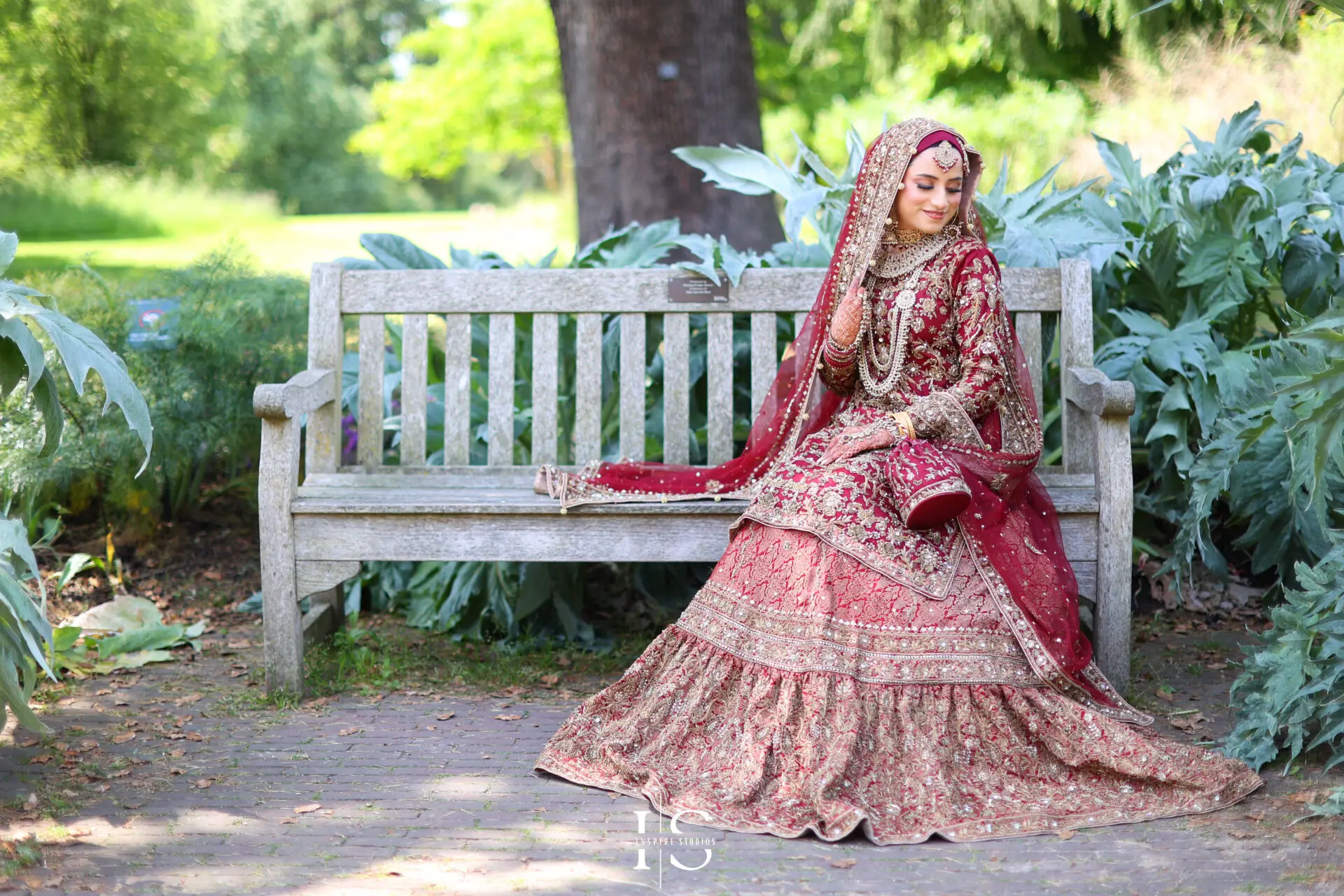 Bride photo session at Kew Gardens captured by baraat wedding photographer in London.
