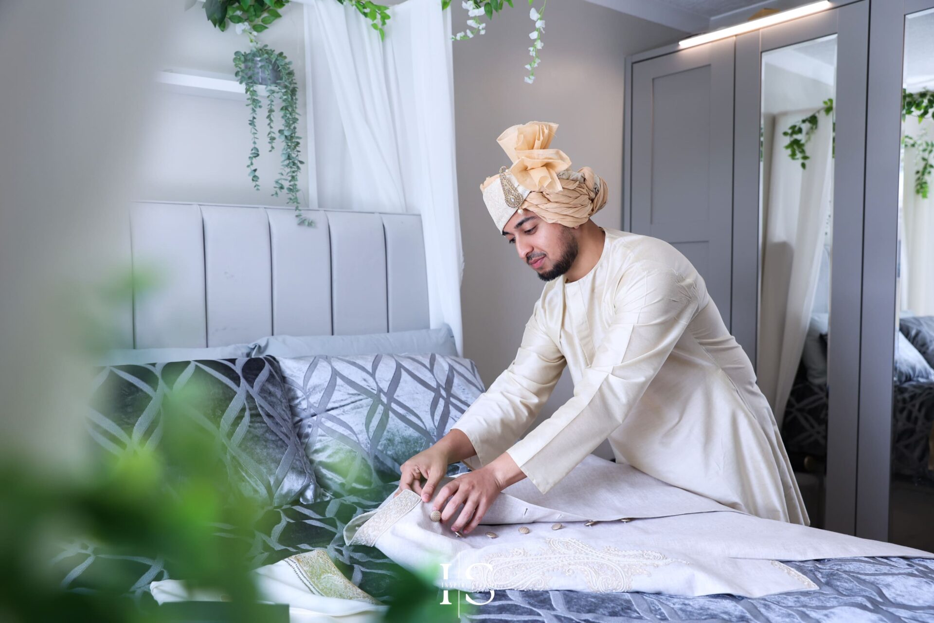 Groom getting ready during baraat wedding photography in London.