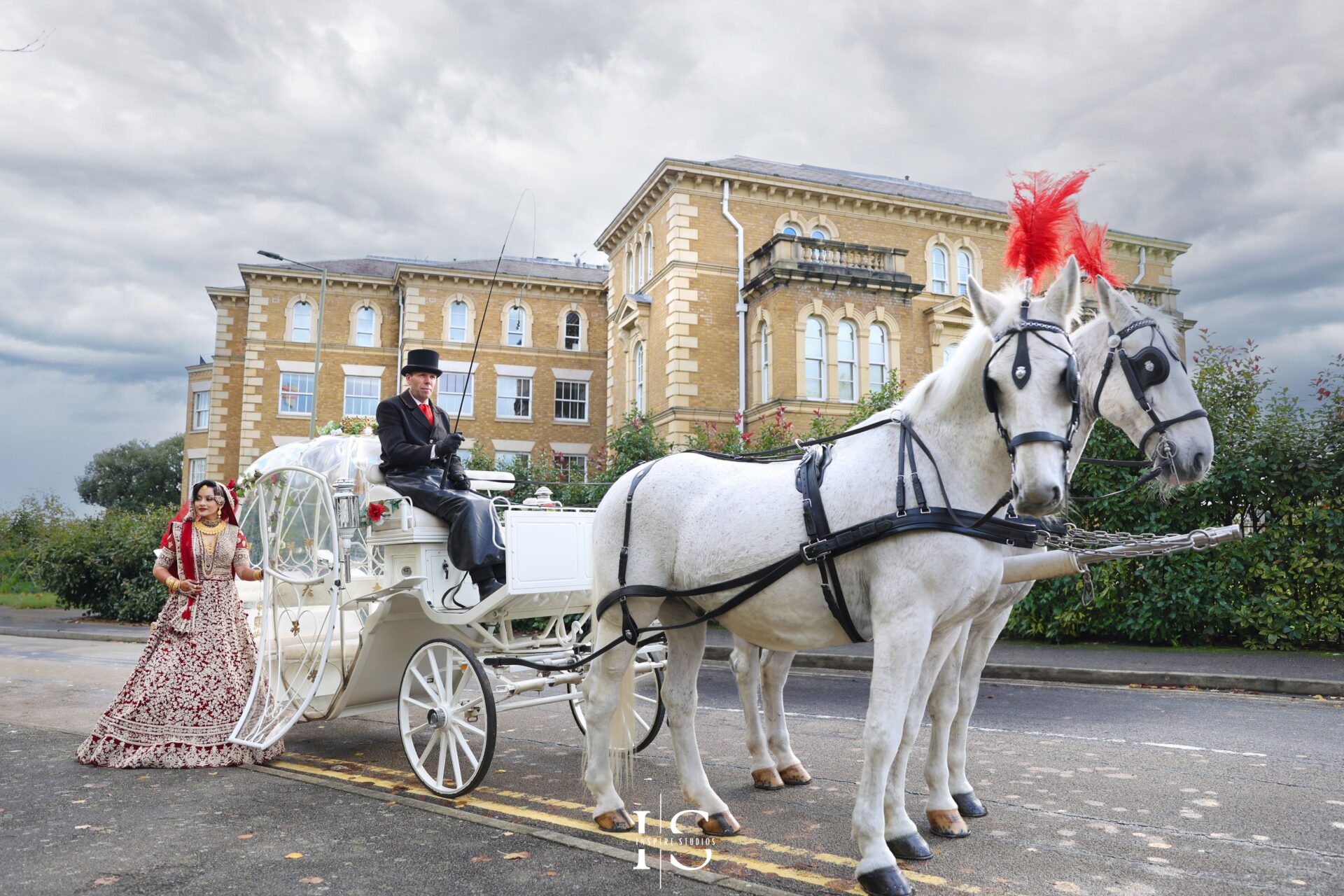 Photo captured by Inspire Studios of a bride dressed in baraat wedding dress.