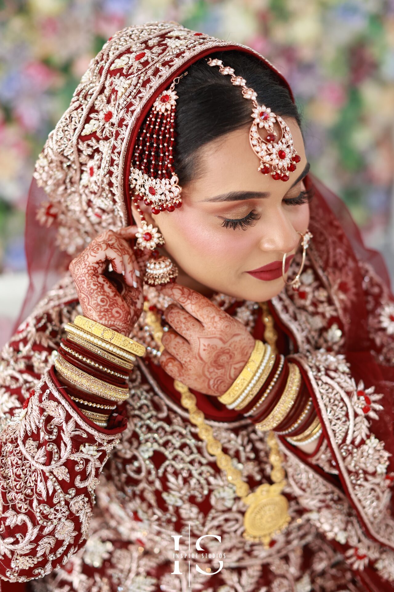 Bride getting ready during baraat wedding photography in London.