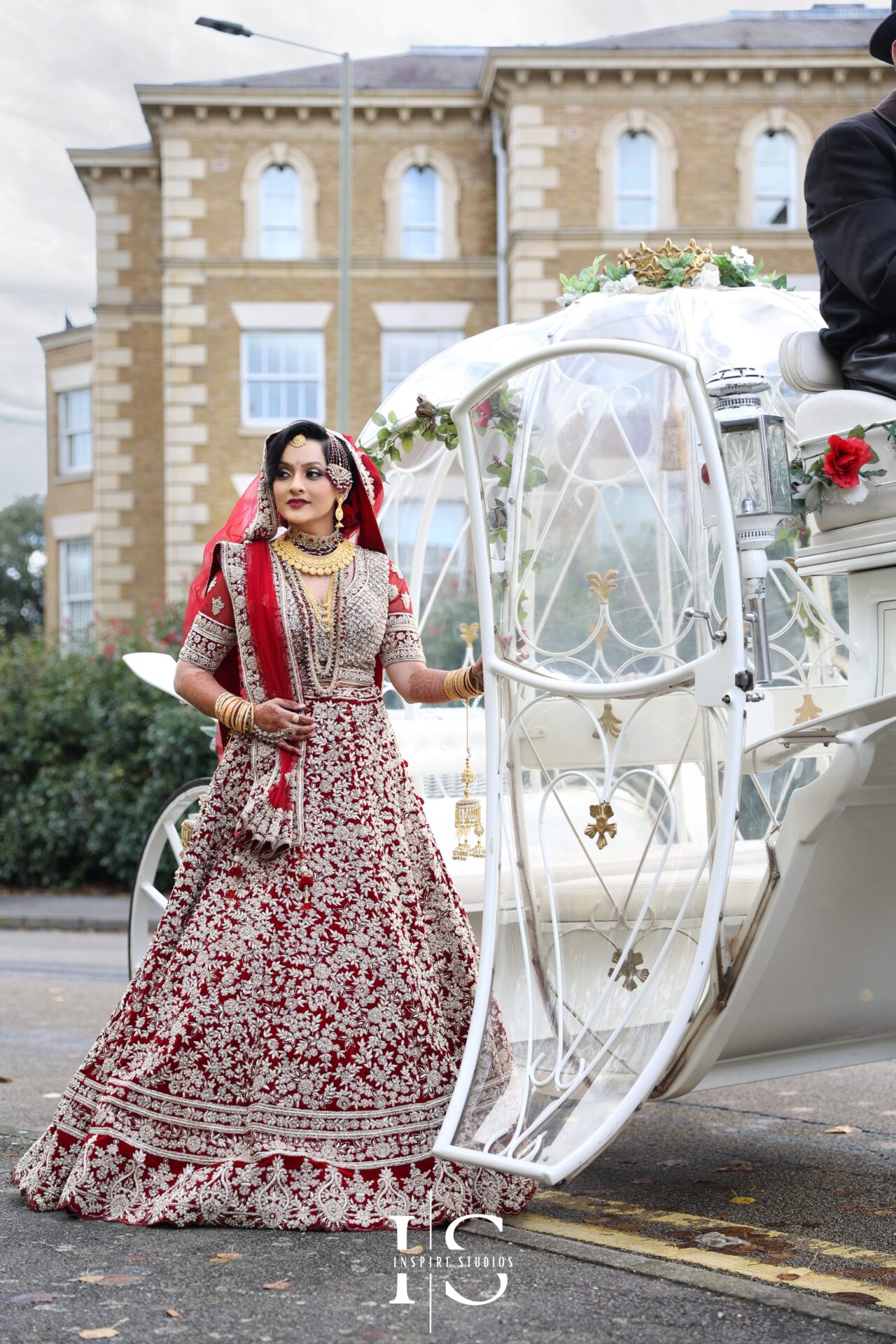 Female wedding photographer in London capturing a bride during her Baraat wedding.