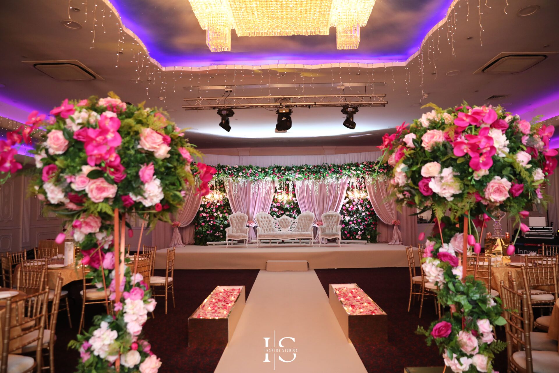 Prince & Princess Wedding Hall venue decorated with red, pink and white flowers for nikkah ceremony.