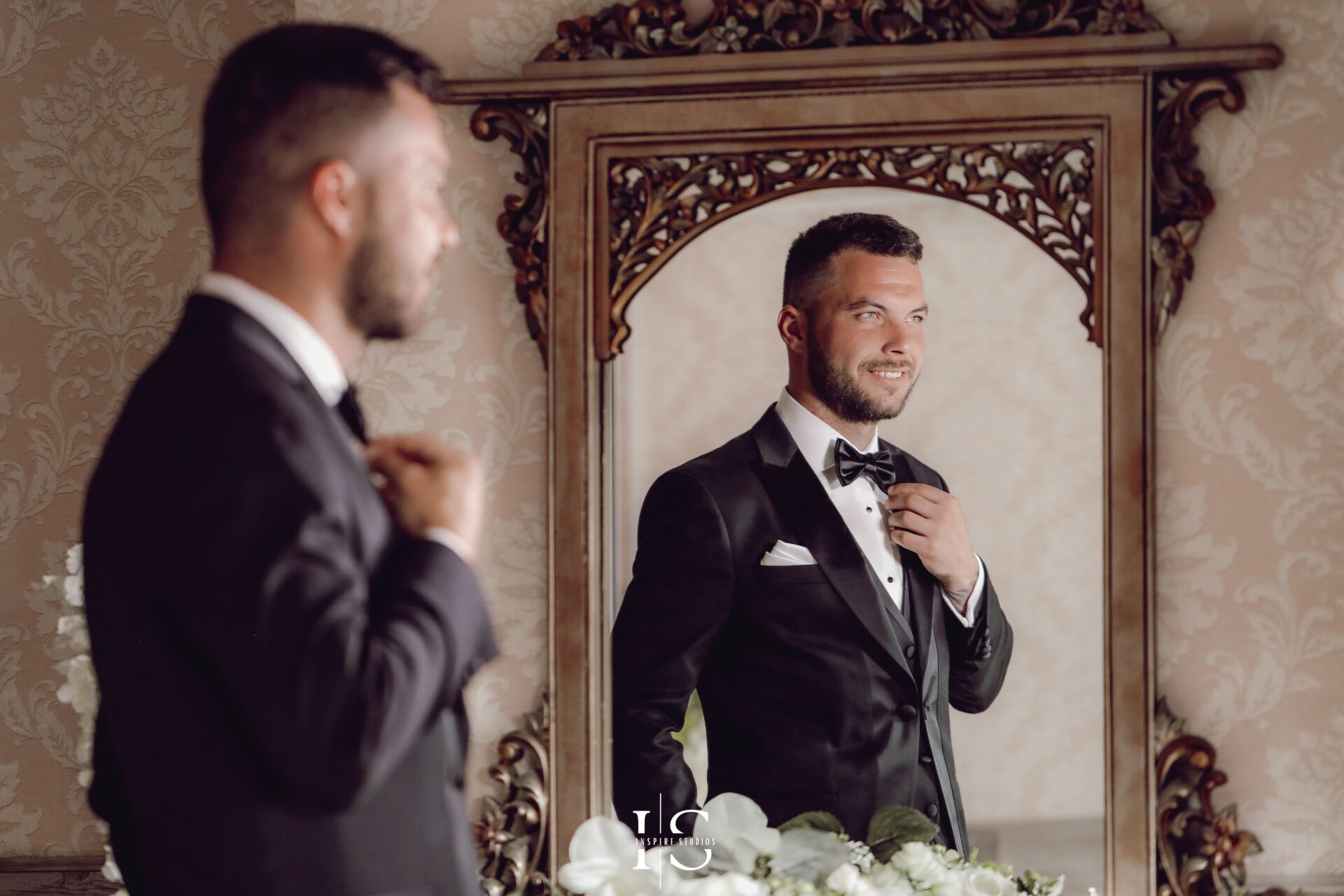 Wedding photographer in London capturing groom getting ready for his romanian wedding at church.