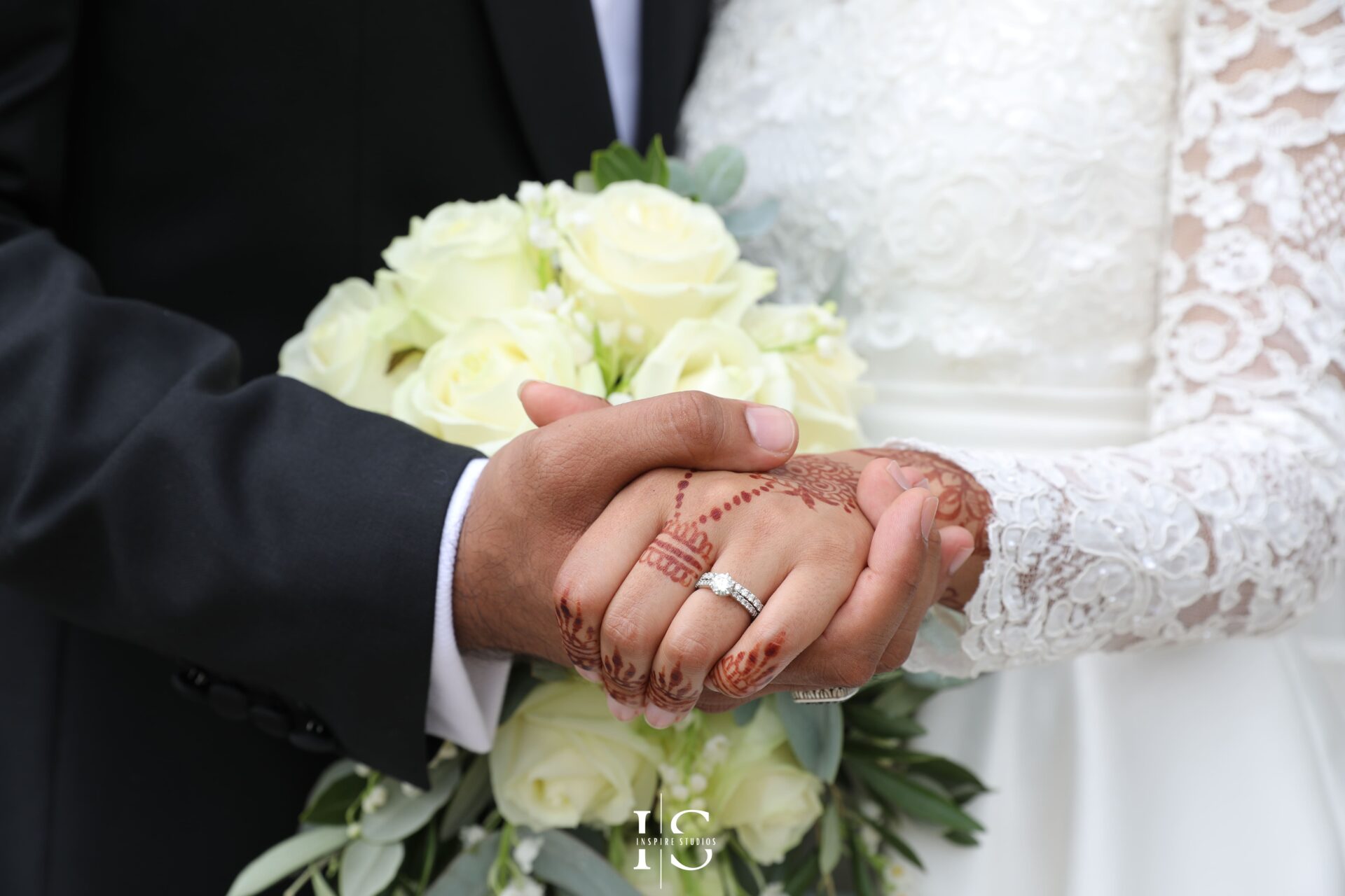 Female wedding photographer in London capturing bride and groom holding hands together after the registry.