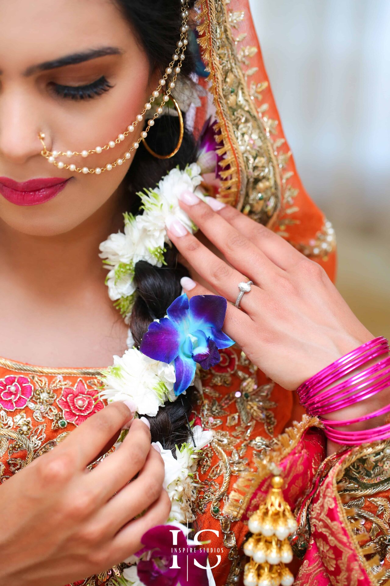 Bride wearing a traditional, vibrant outfit during her Mehndi wedding photography ceremony.