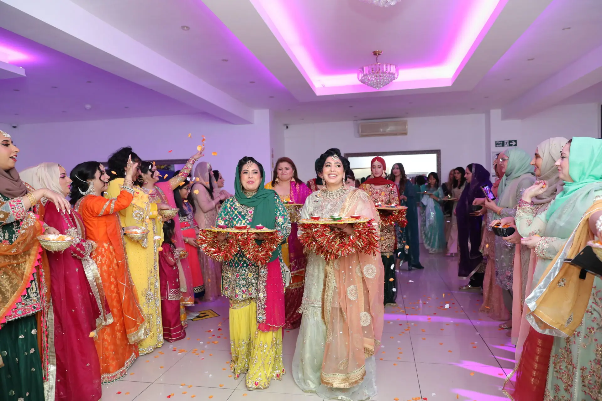 Every Mehndi celebration feels incomplete without the grand entrance of the groom’s side. Welcomed with flowers and warm smiles, they are the honored guests of the evening, bringing joy and thoughtful gifts for the bride.