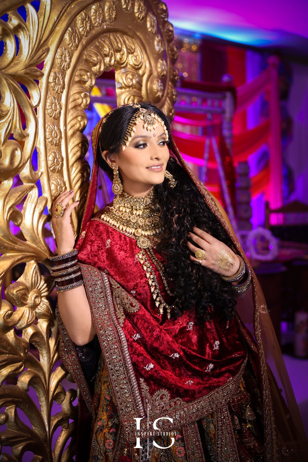 Bride wearing a traditional, vibrant outfit during her Mehndi wedding photography ceremony.