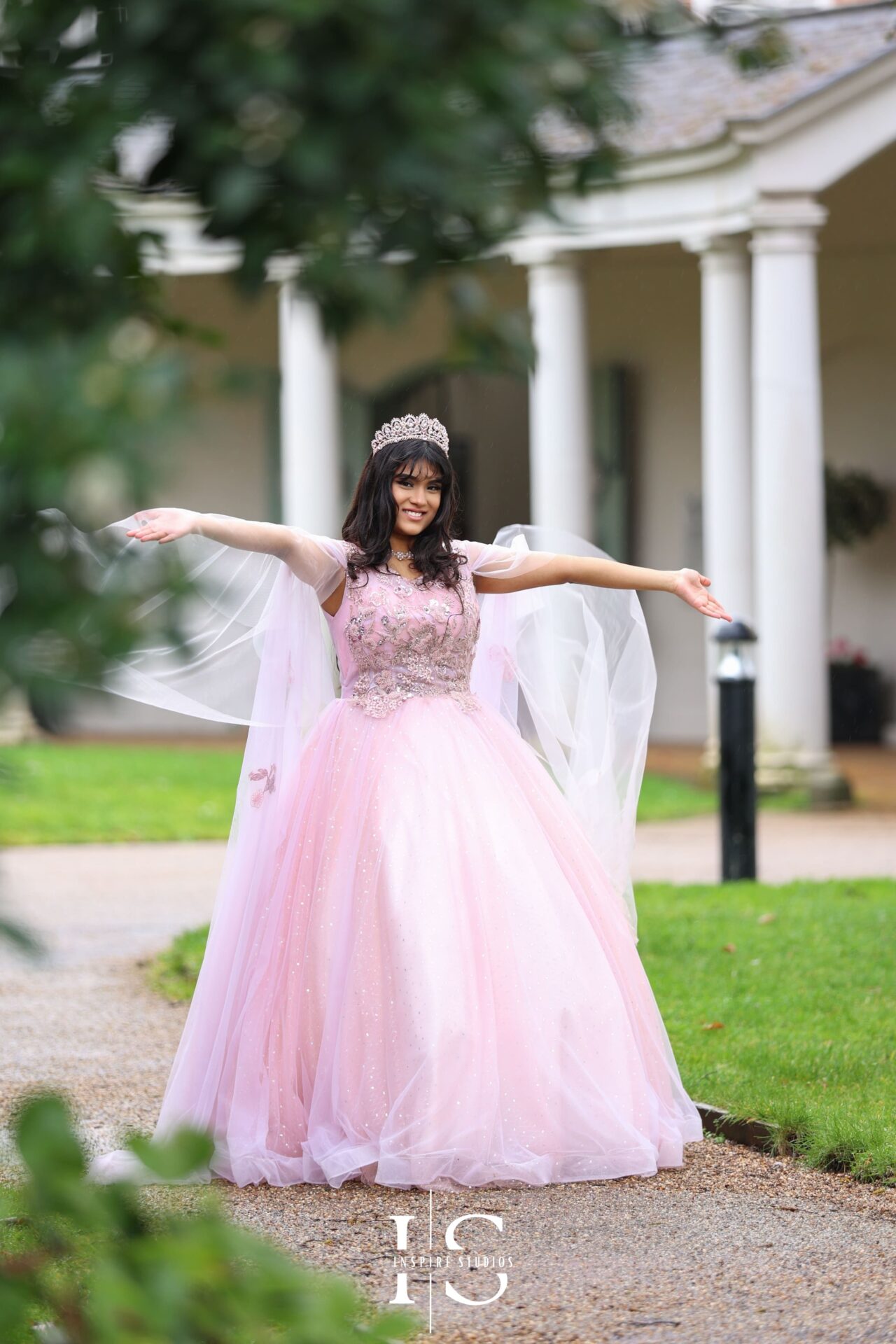 Valentines park photoshoot of a birthday girl posing in pink dress.