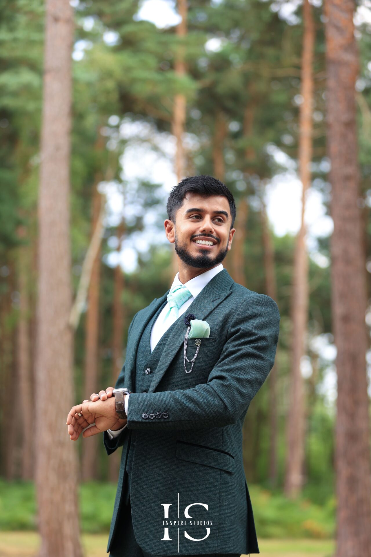 Walima photographer london capturing groom's smile whilehe gets ready for the wedding.