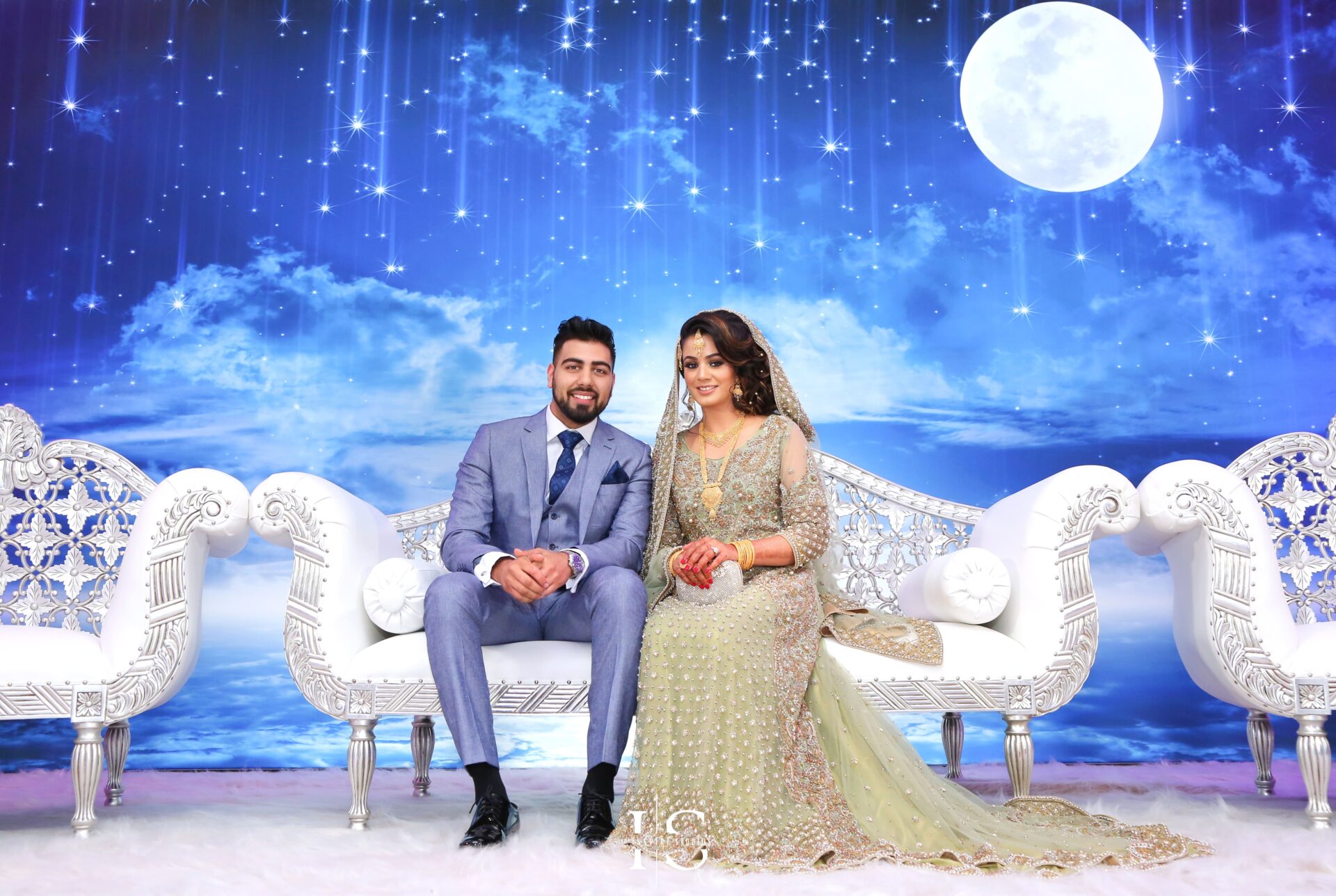 Walima wedding photography of bride and groom couple shoots on stage.