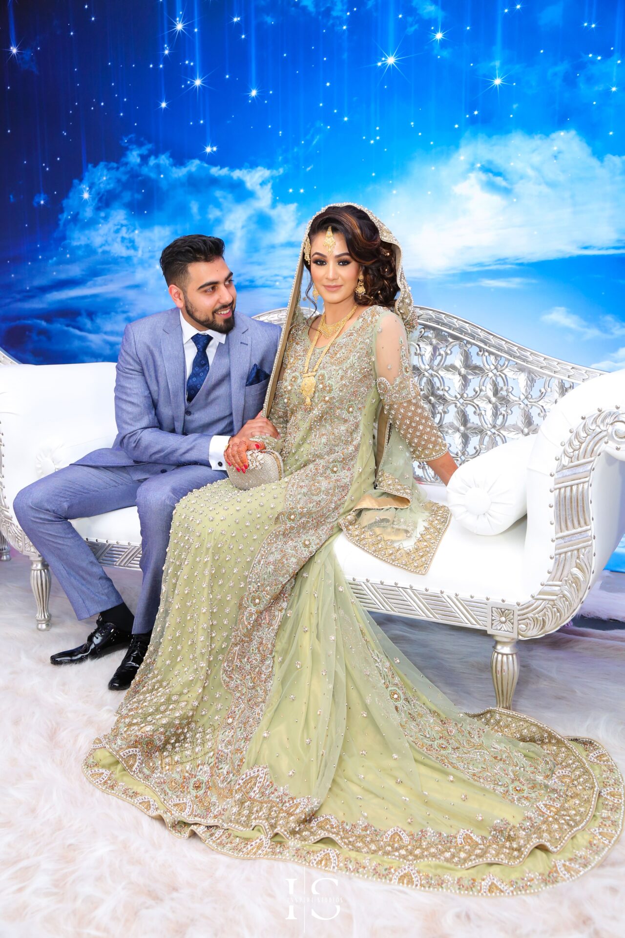 Walima wedding photography of bride and groom couple shoots on stage.