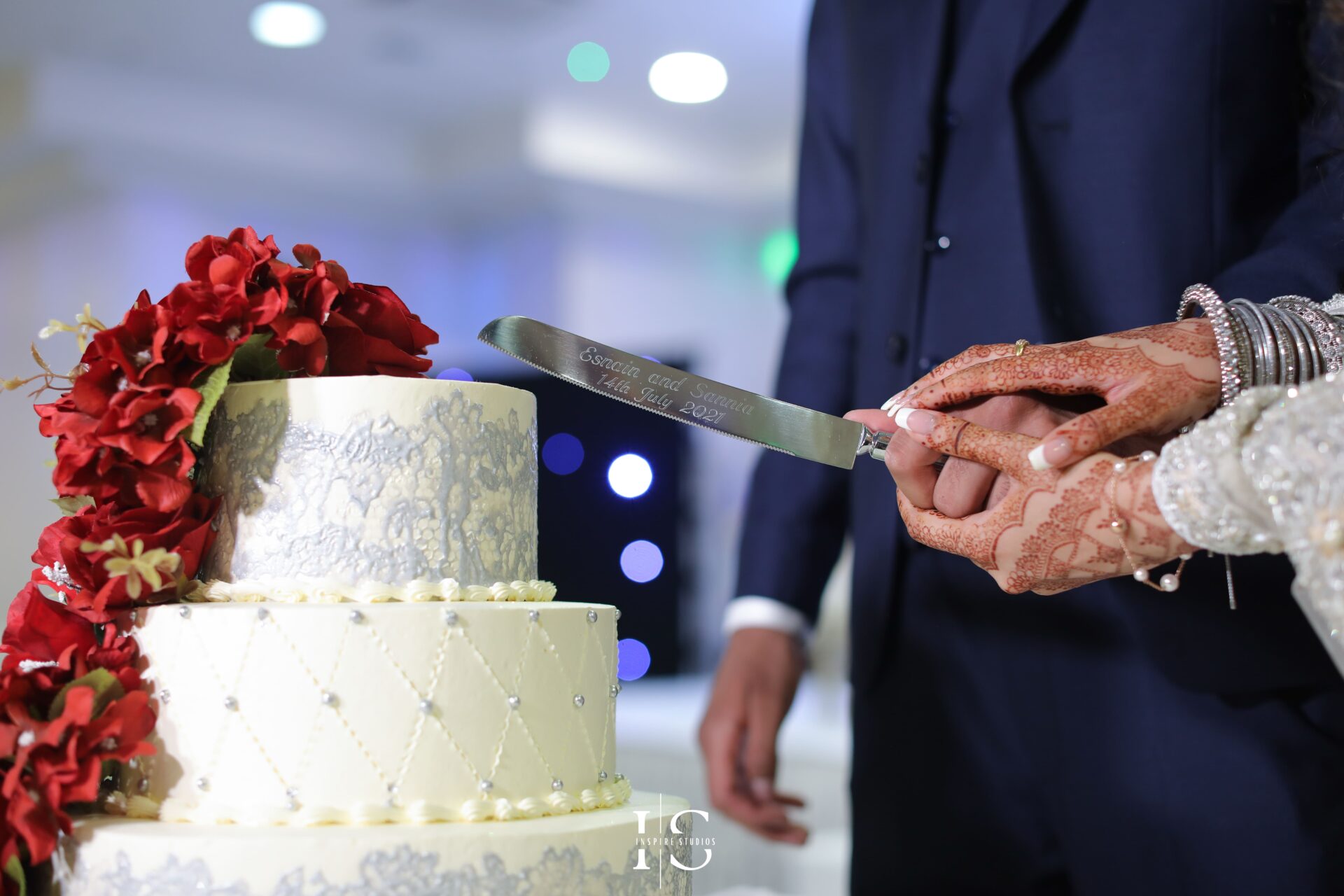 Moment of cake cutting by bride and groom captured by walima wedding photographer in London from Inspire Studios.