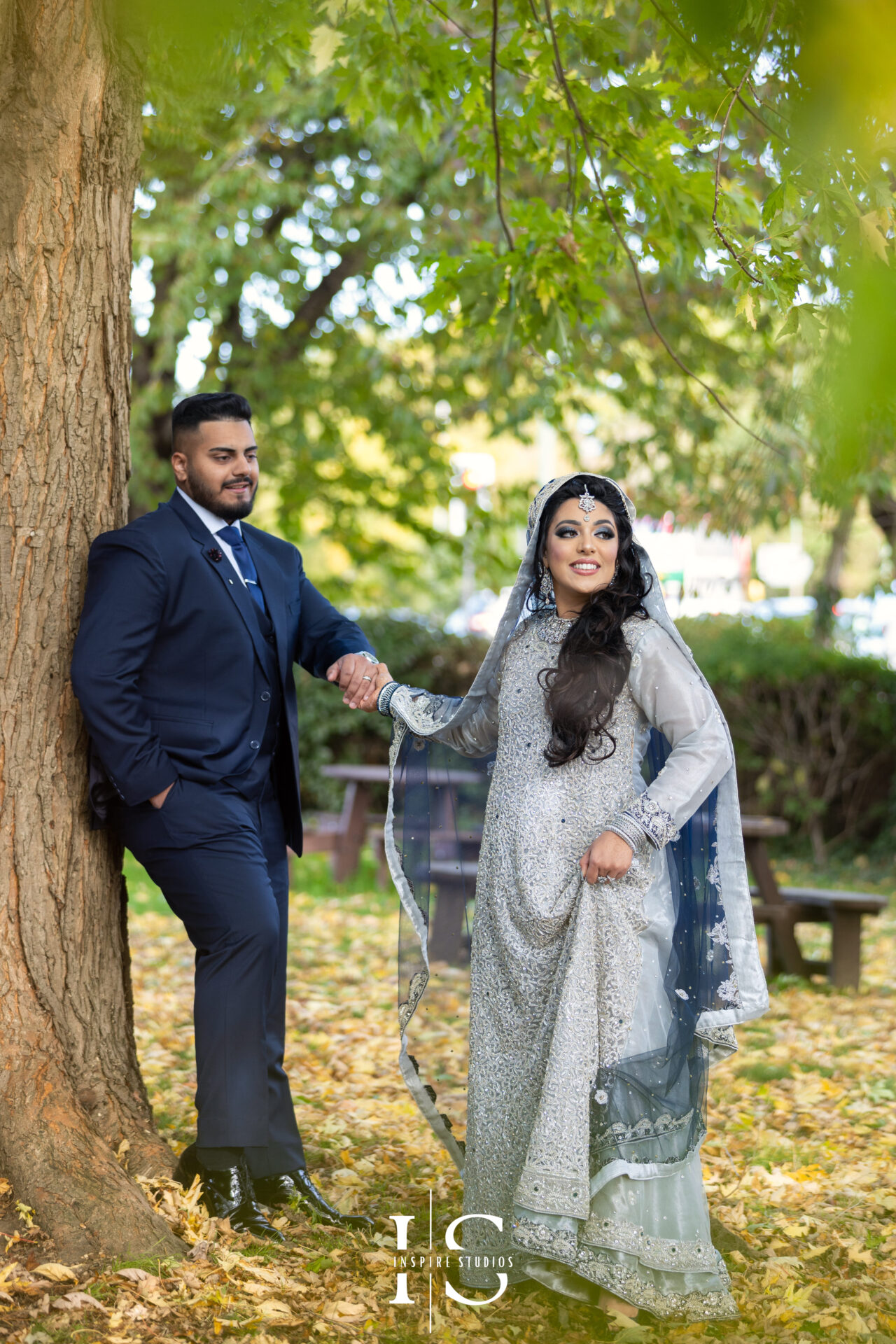 Walima wedding photographer London documenting the groom getting ready, adjusting his tie before the wedding ceremony.