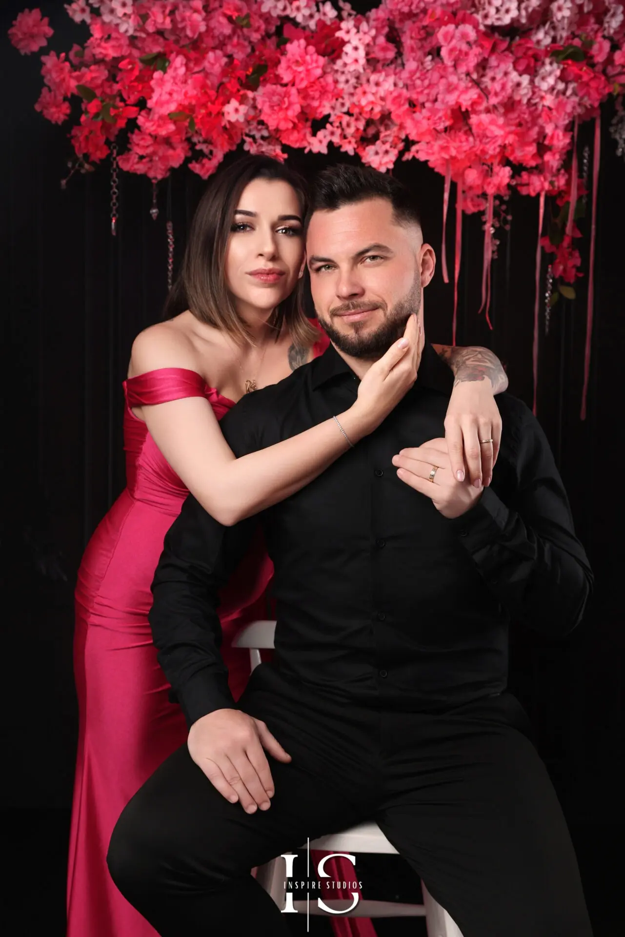 Romantic boudoir couple photoshoot in a London studio with intimate lighting.