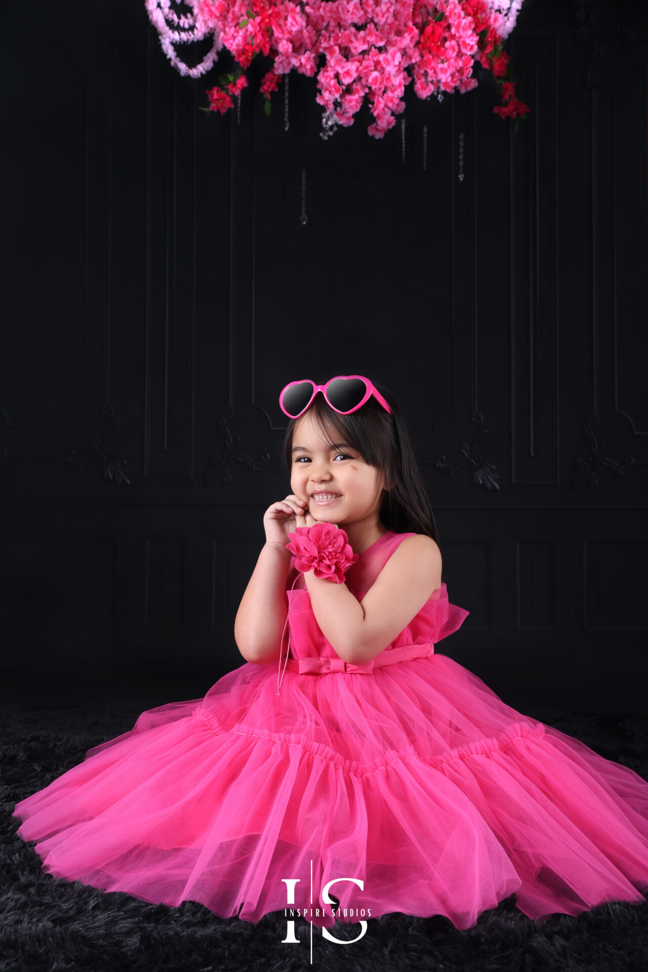 Vibrant children's birthday photoshoot in London with balloons and decorations.