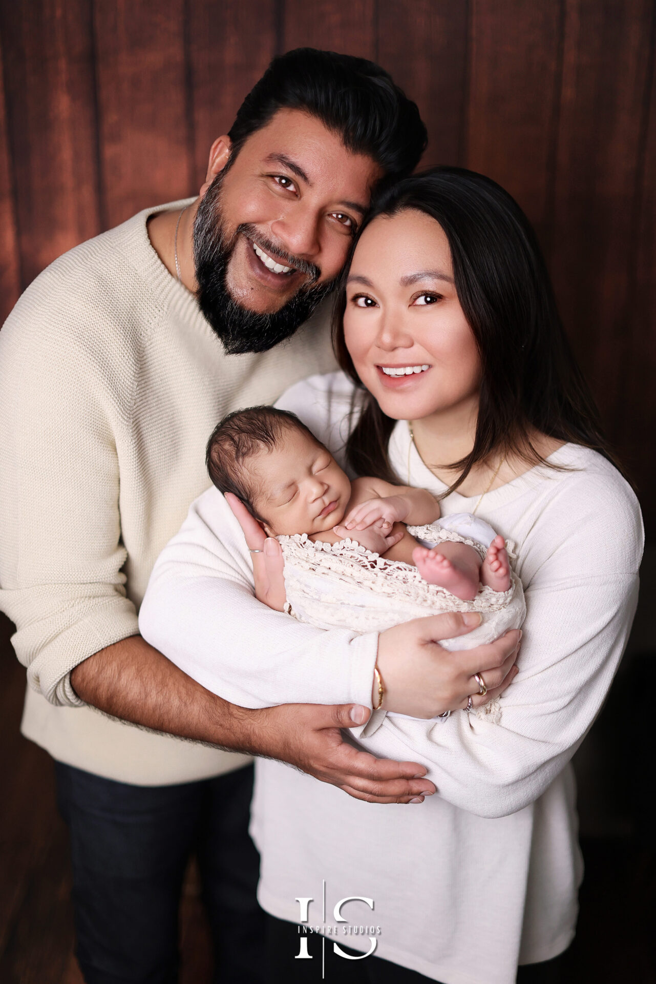 Beautiful family portraits with baby taken by a London-based professional photographer.