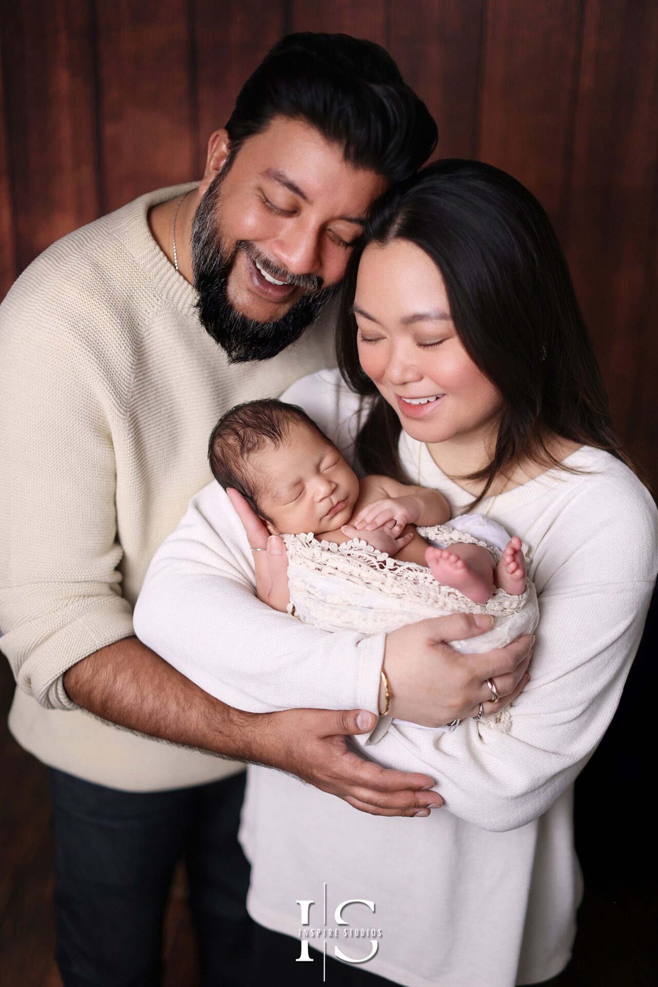 Professional family and baby photographer in London studio capturing love and connection.