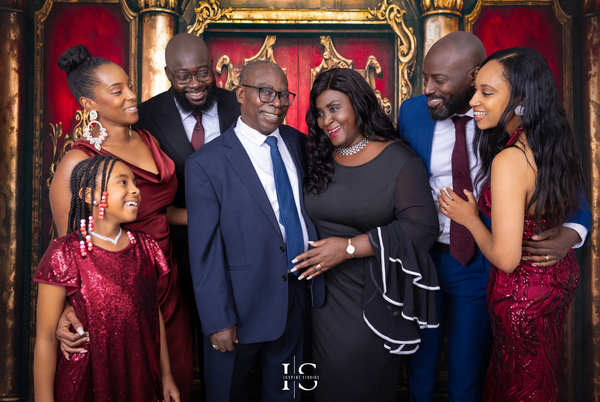 Candid family portrait in a cozy setting by Inspire Studios