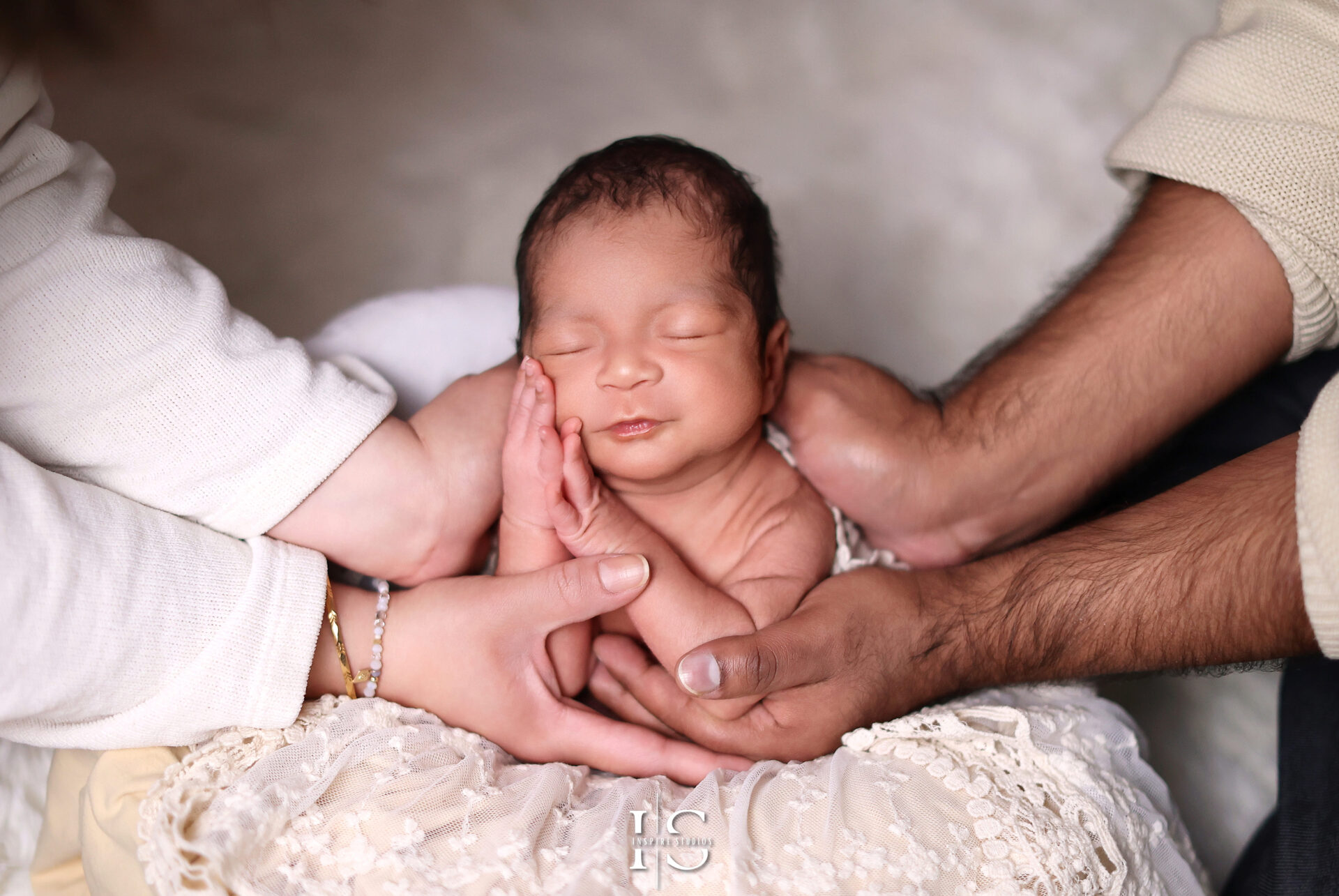 Heartwarming baby and family photoshoot in a cozy London photography studio.