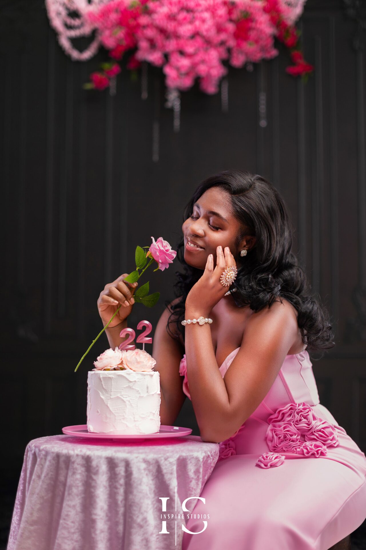 Celebrate love with a stunning Valentine’s Mini Session featuring a black Victorian wall and pink florals.