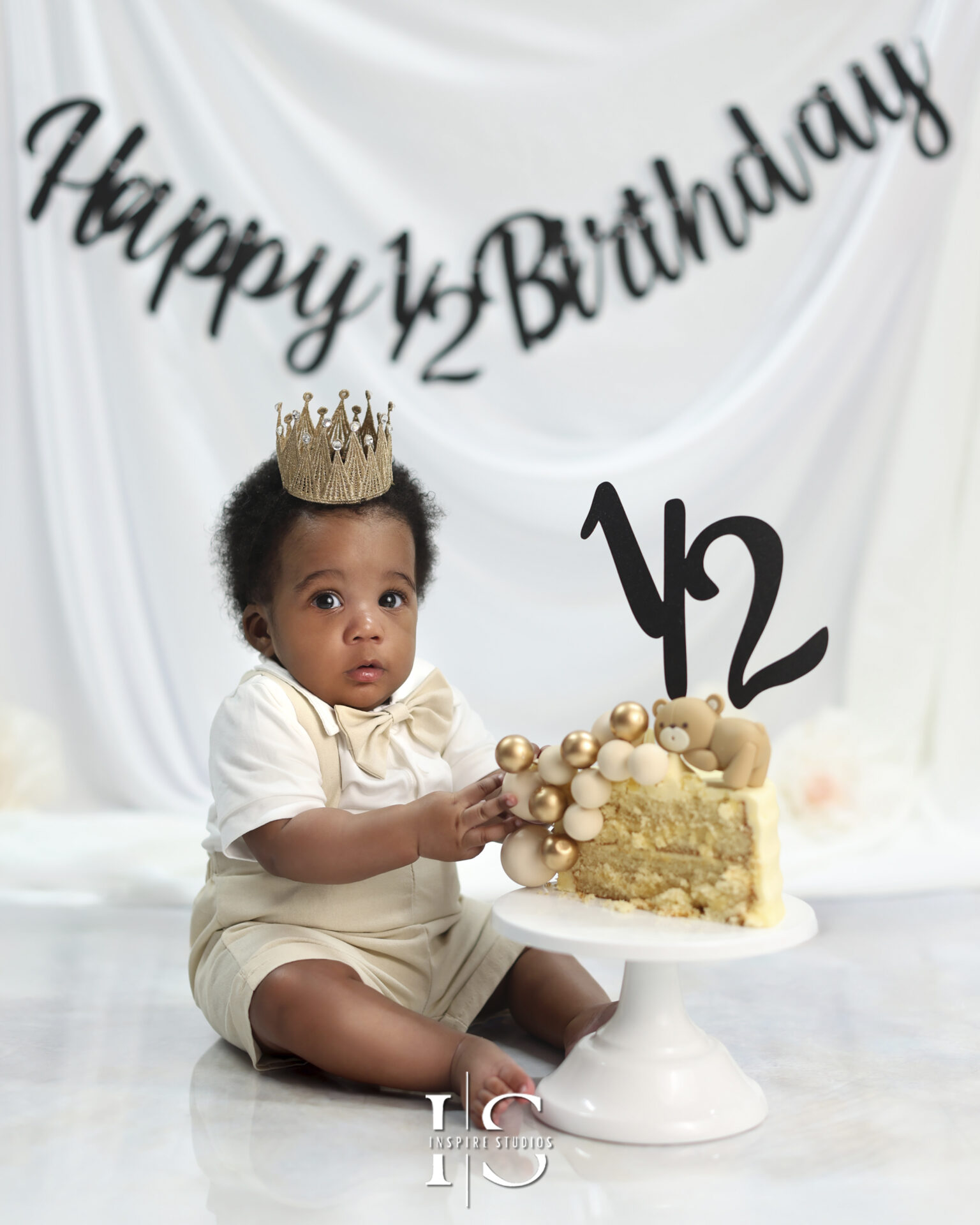 Baby sitting up in a themed half birthday photoshoot in London E17 9PT.