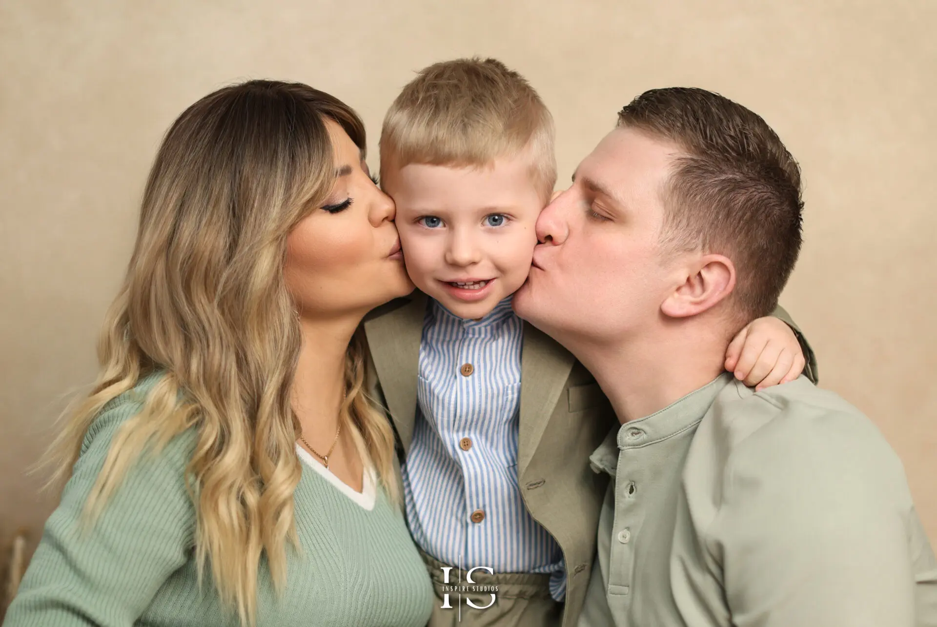 Toddler celebrating third birthday during a family photoshoot in a London studio.