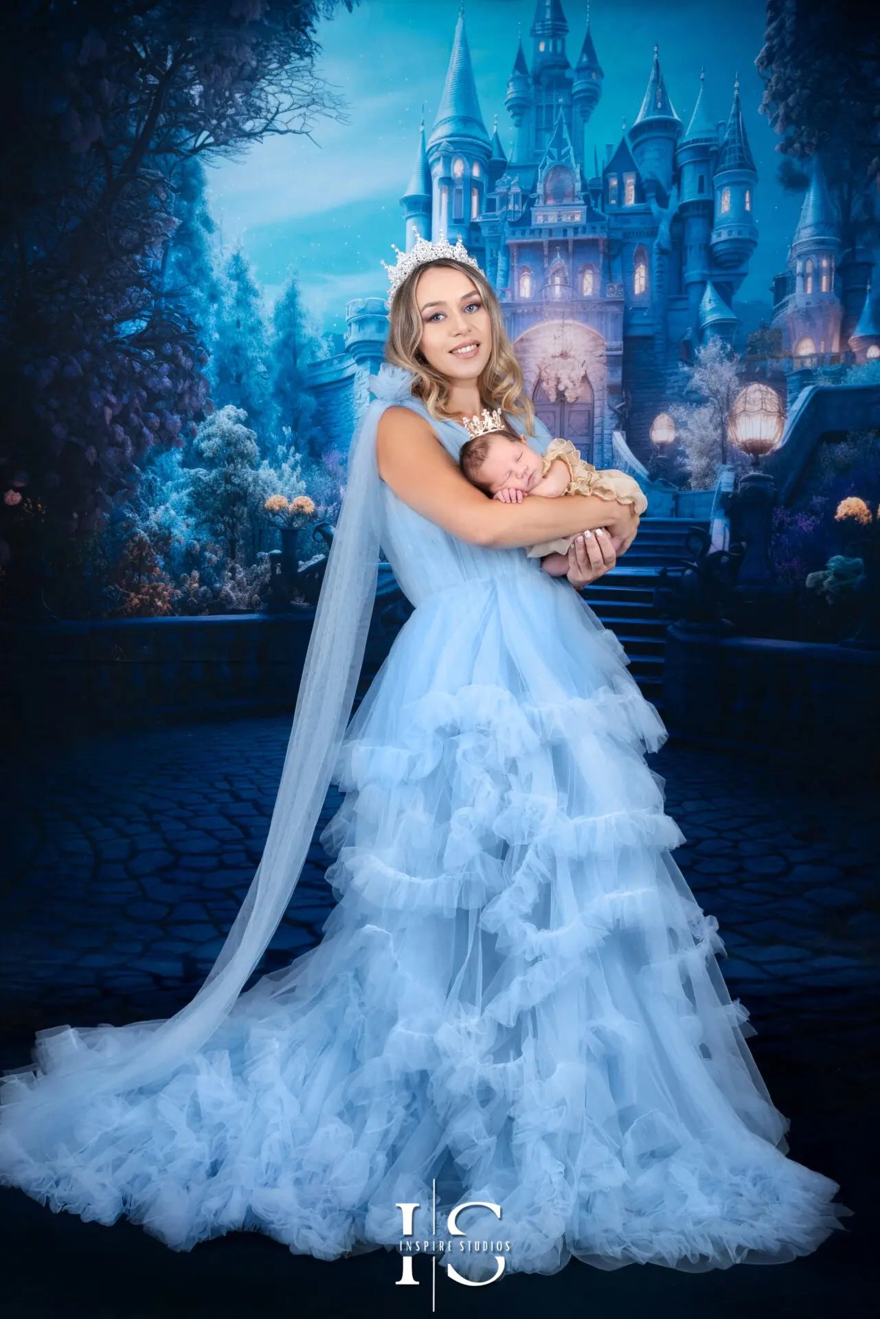 Dreamy Cinderella studio photo shoot in London, combining maternity elegance and newborn charm.