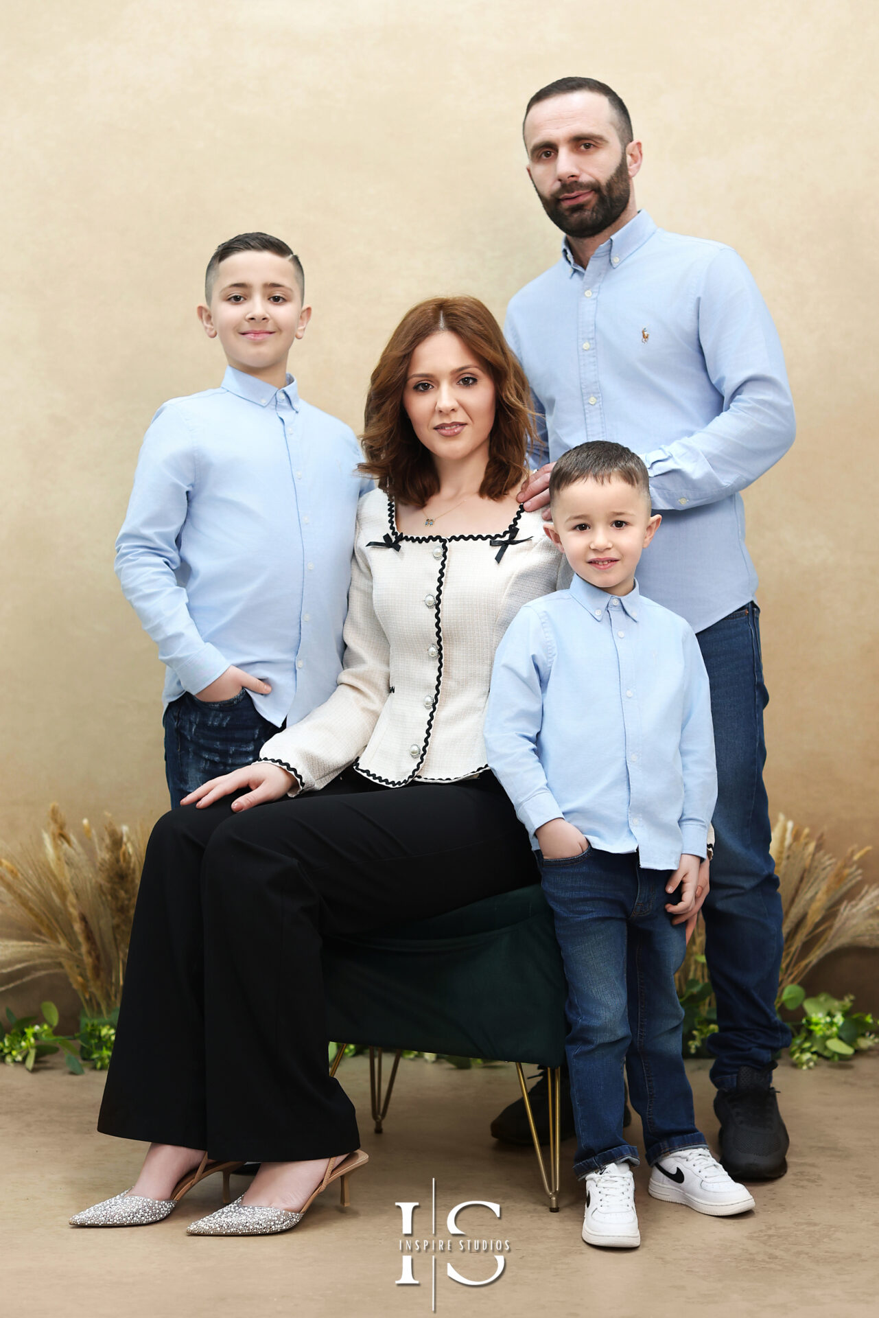 Family posing during a professional photo session in East London with a natural light setup.