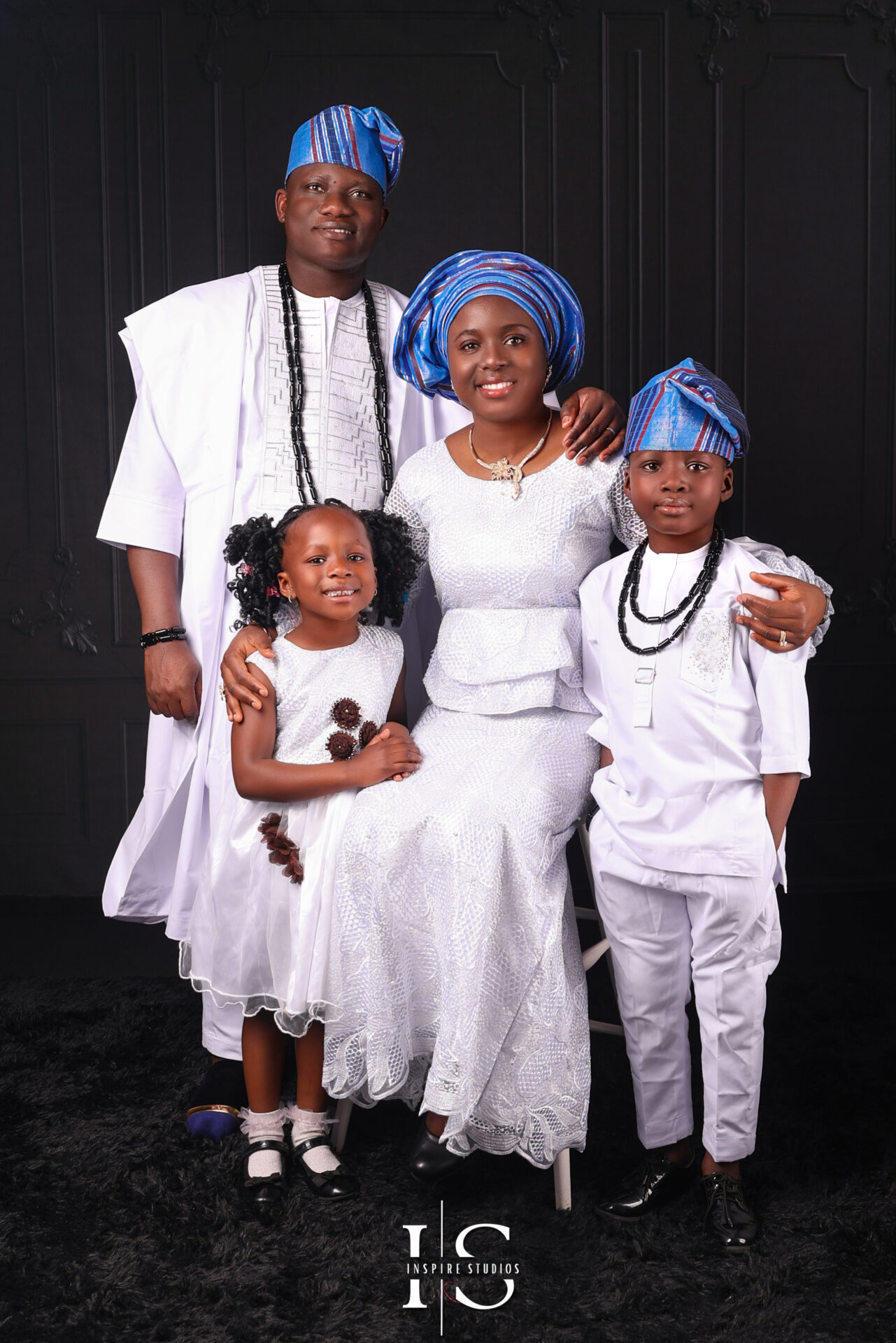 Multiple family members during an in-studio session with clean, soft lighting.