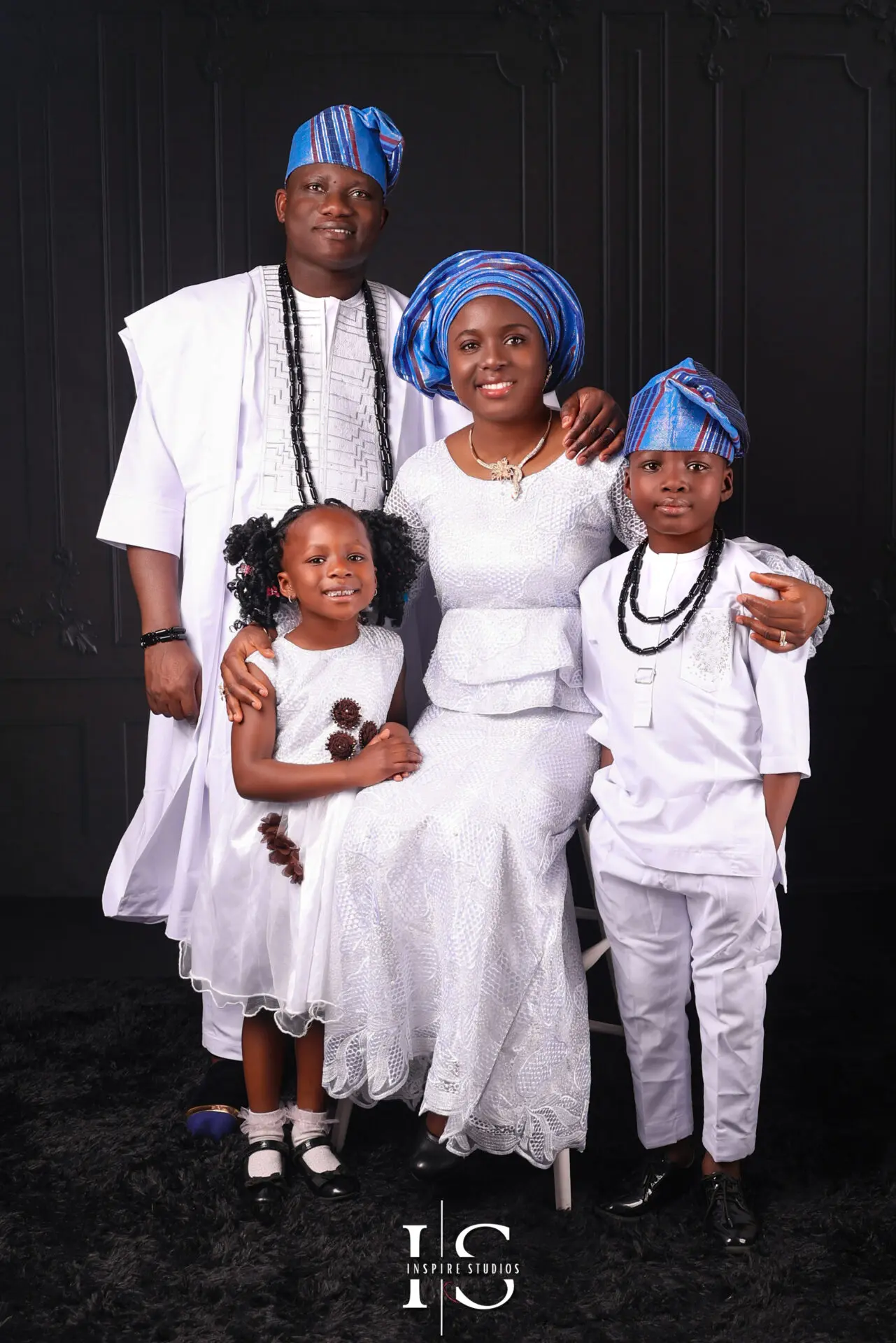 Multiple family members during an in-studio session with clean, soft lighting.
