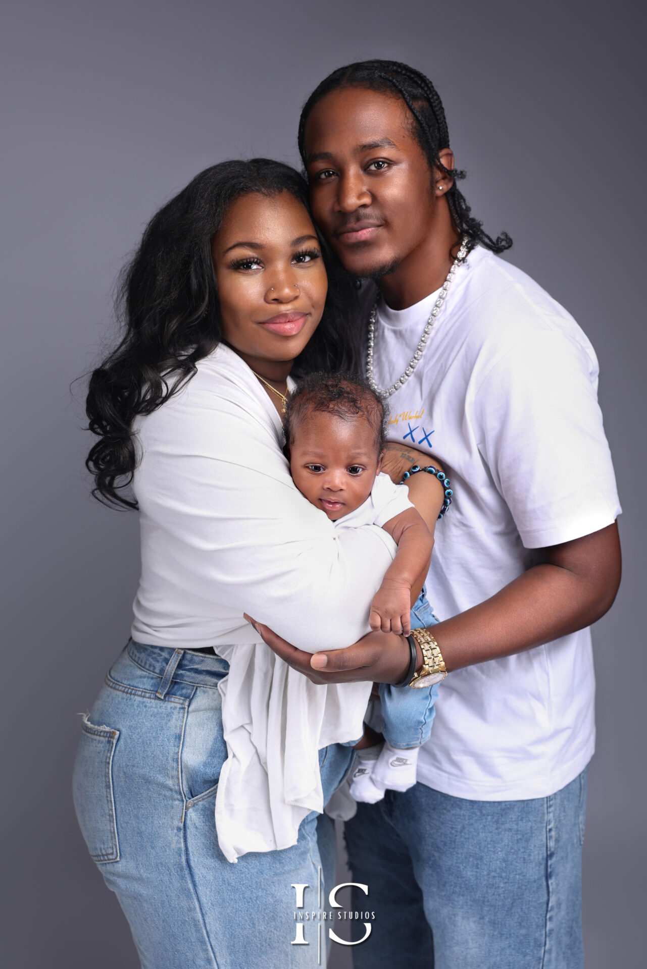 London family photoshoot using a neutral grey background for a timeless look.