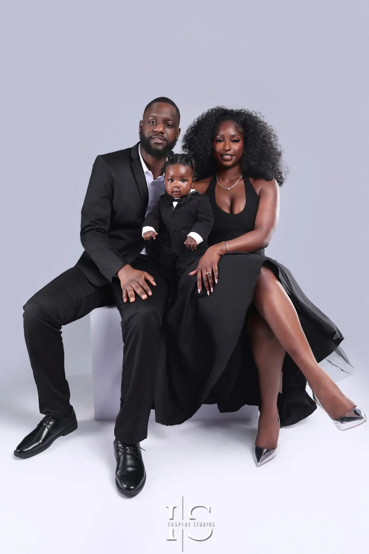 Family holding their baby during a photoshoot in a London photography studio
